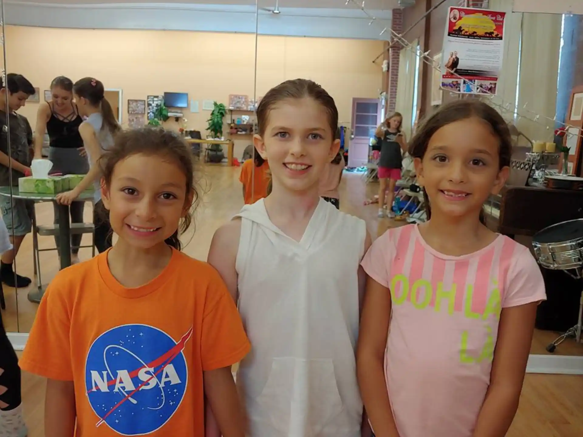 a group of girls posing for a photo