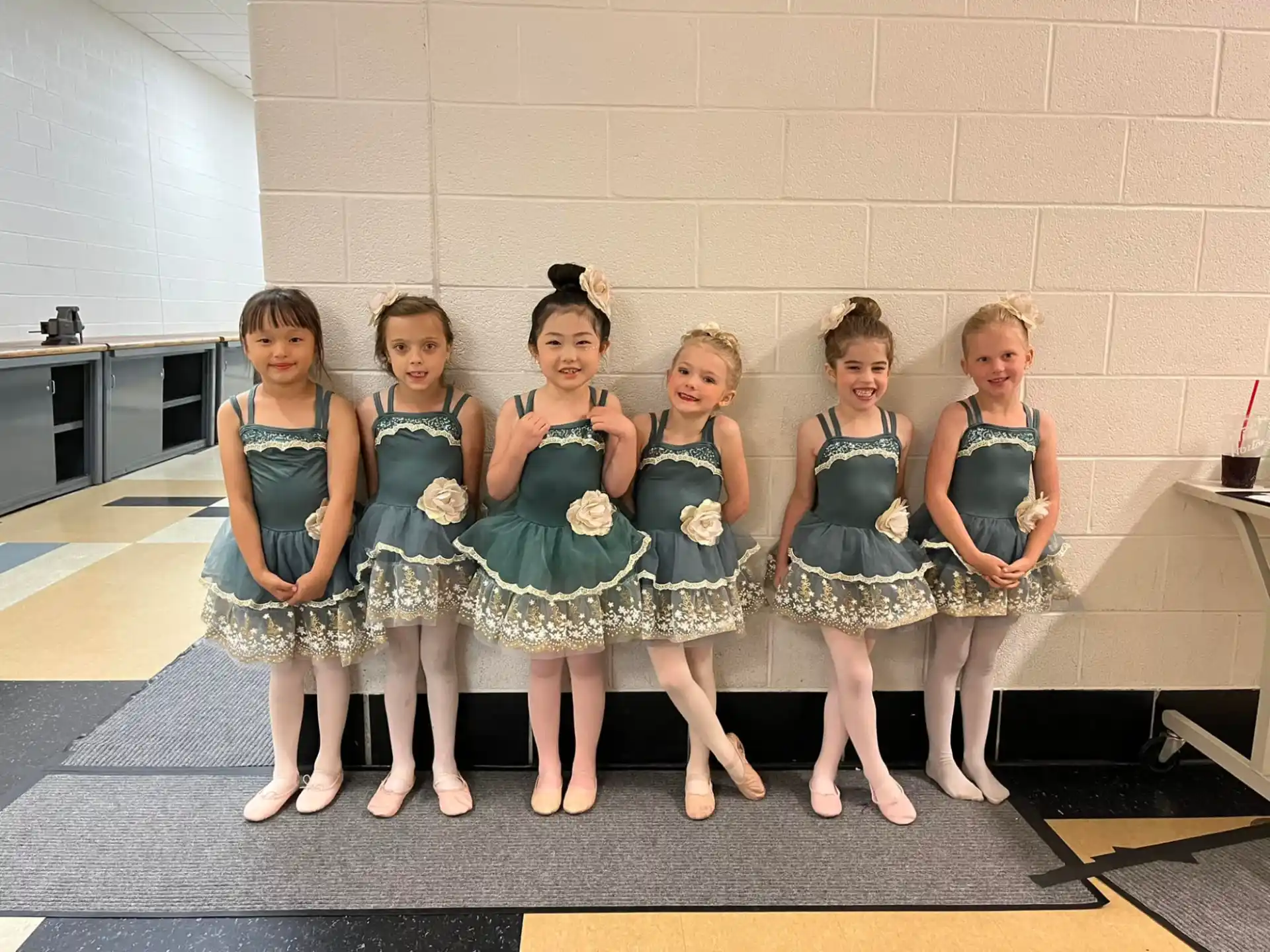 a group of girls in dresses