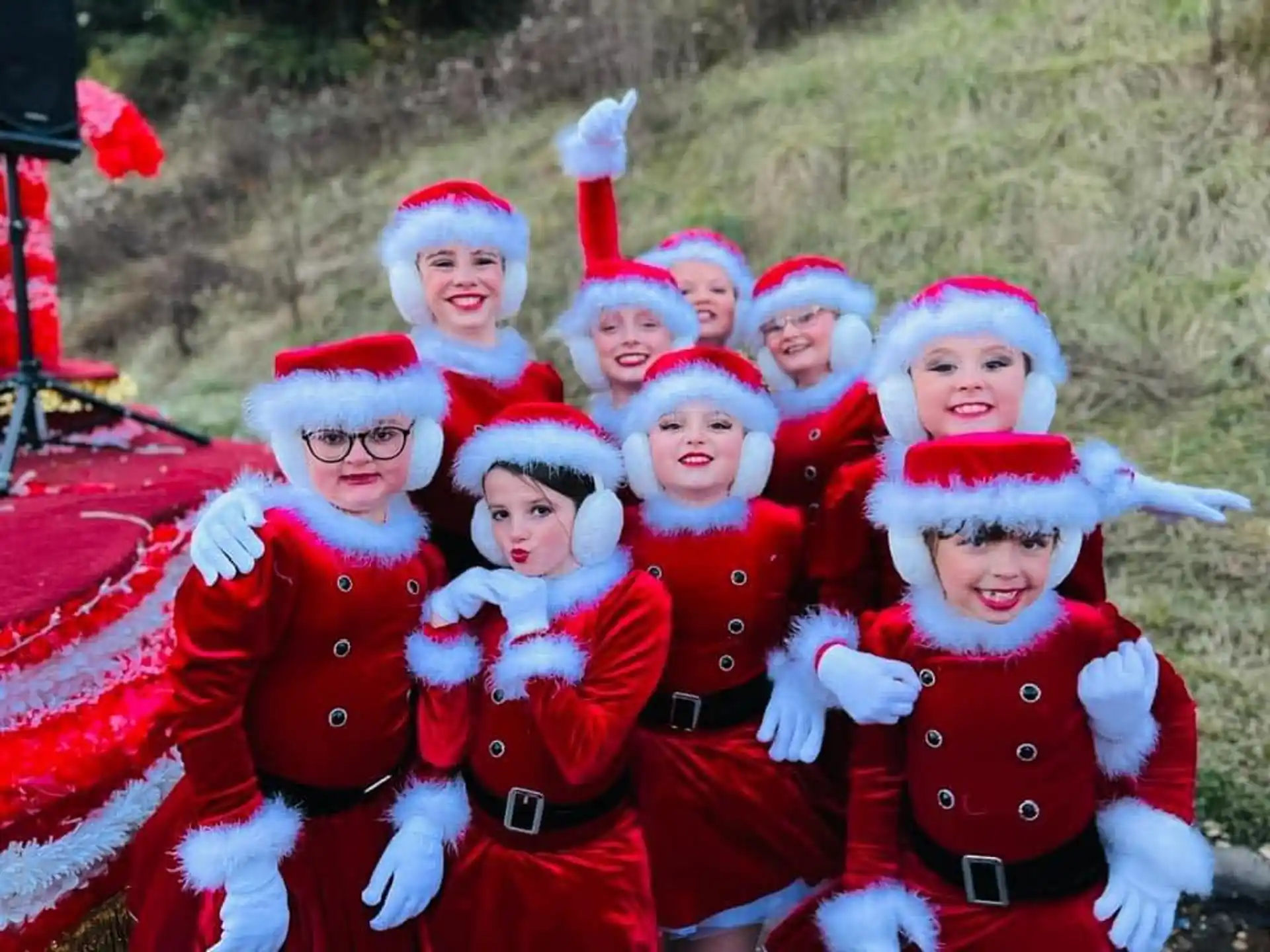 a group of children in red and white clothing