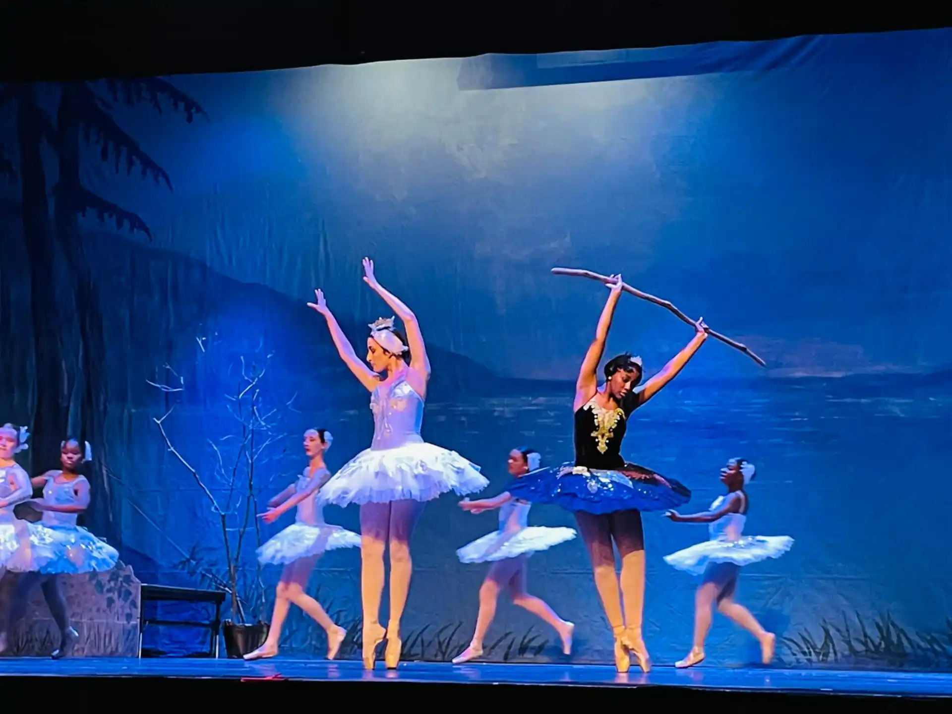a group of women dancing on a stage