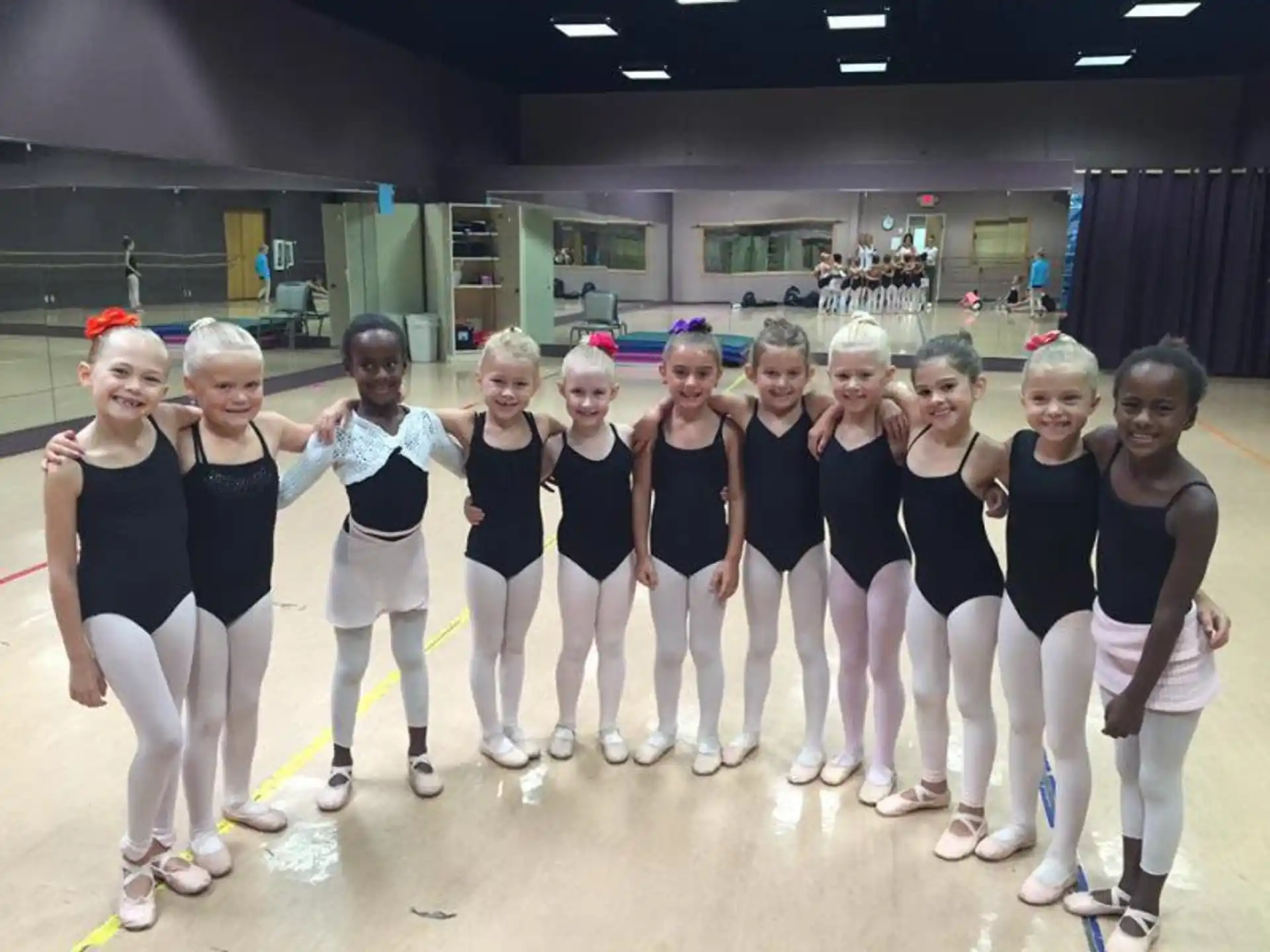 a group of women in matching outfits