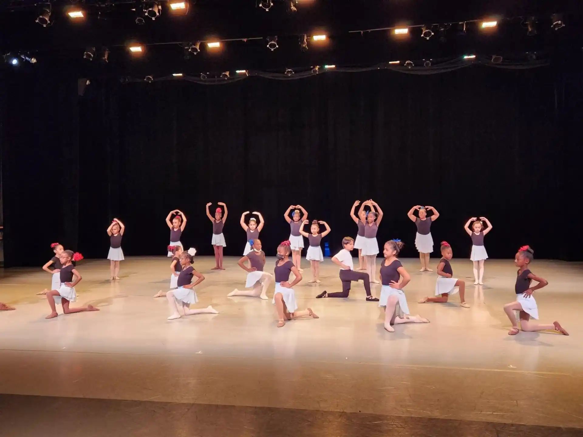 a group of people dancing on a stage