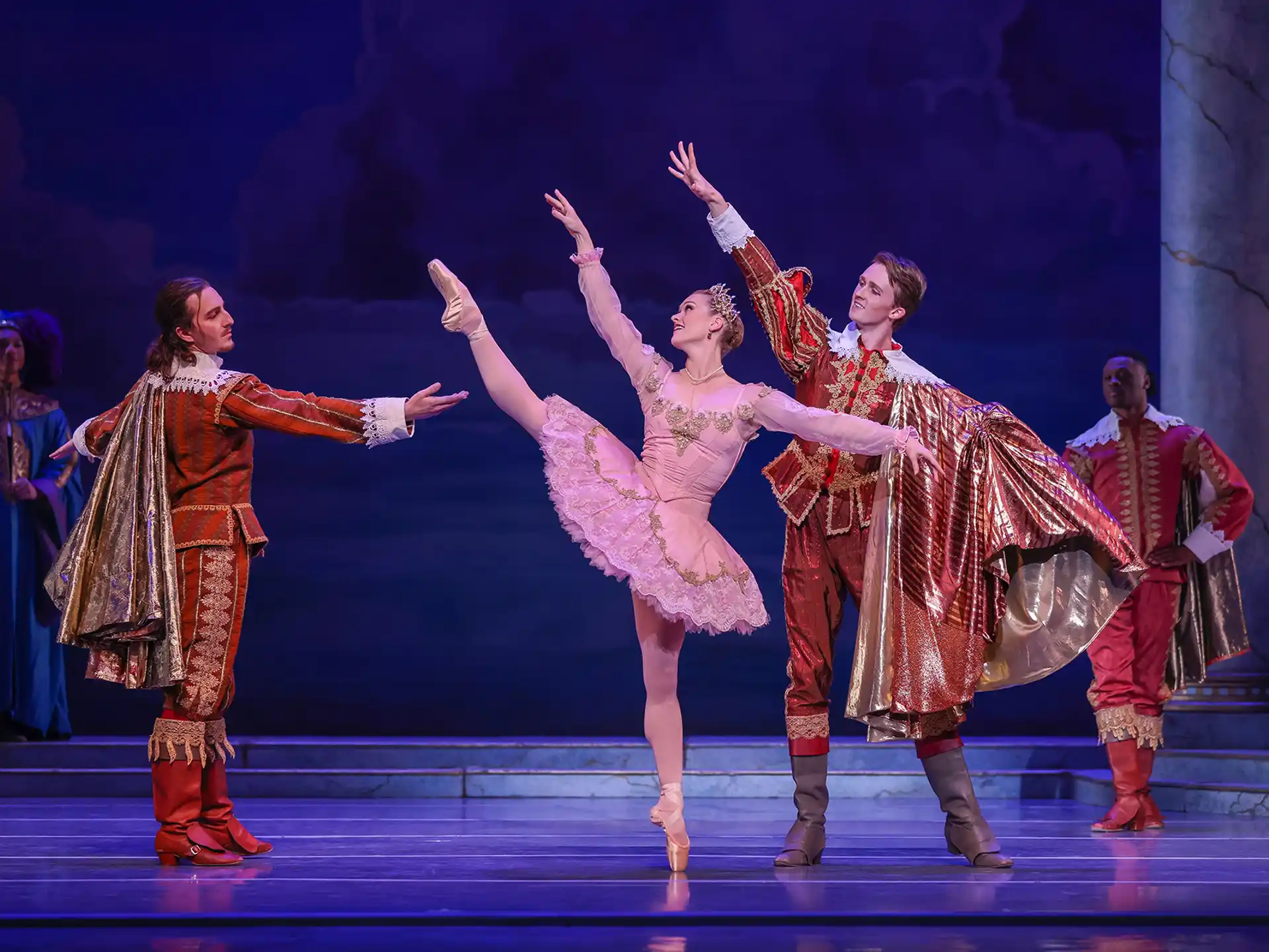 a group of people dancing on a stage