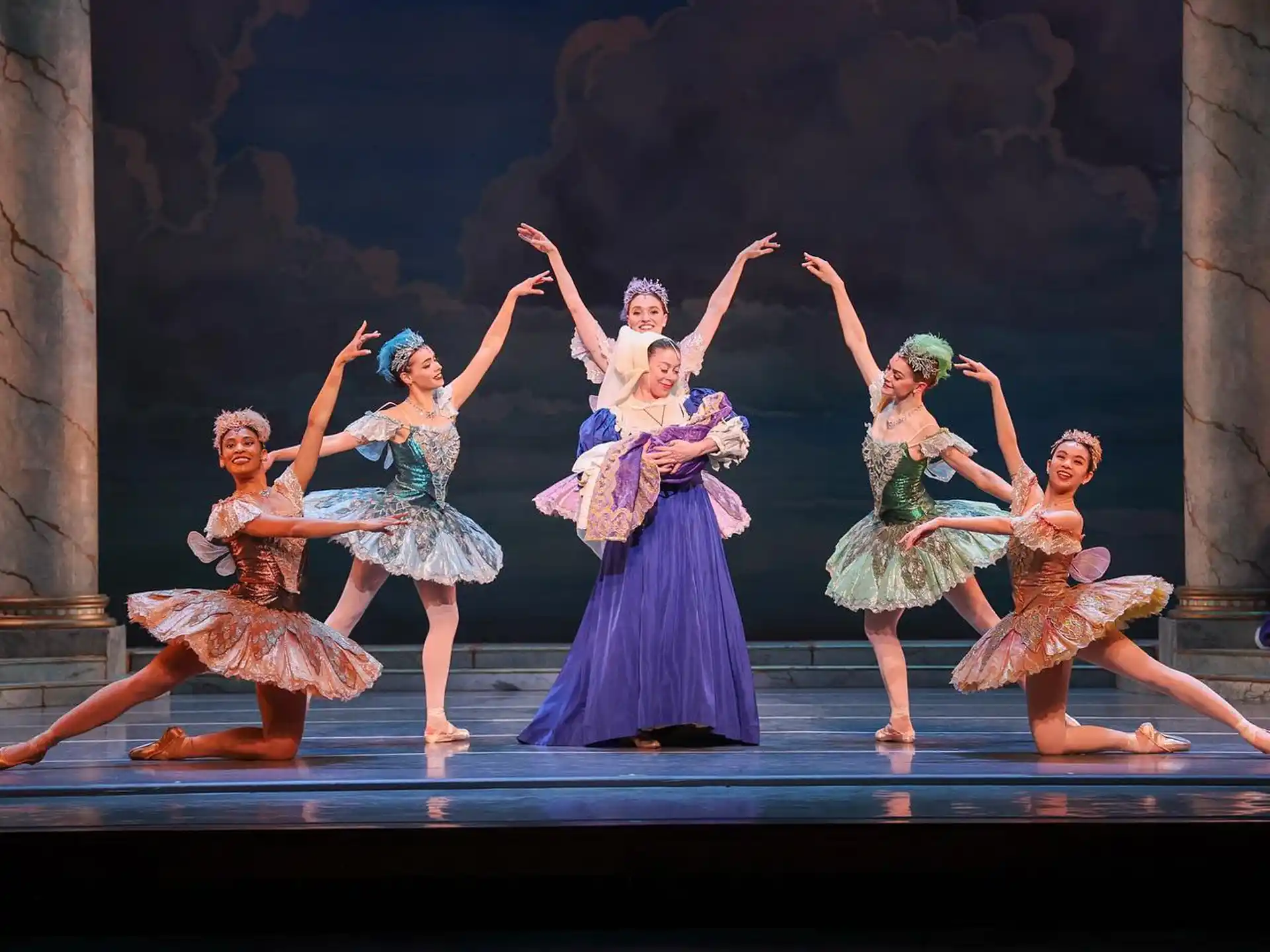 a group of women dancing on a stage