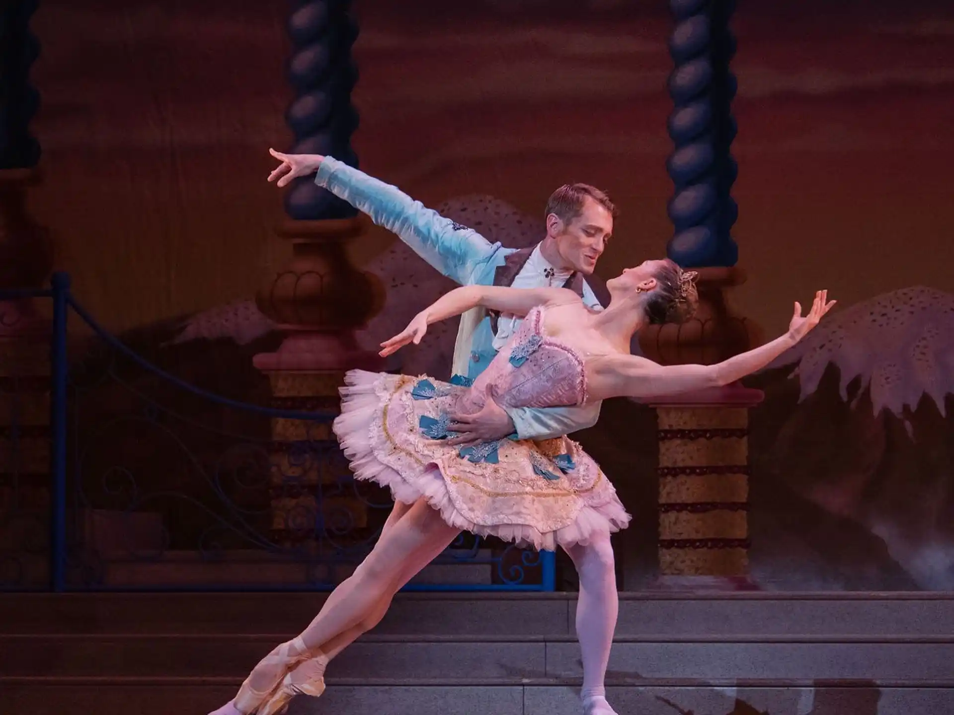 a man and woman dancing on a stage