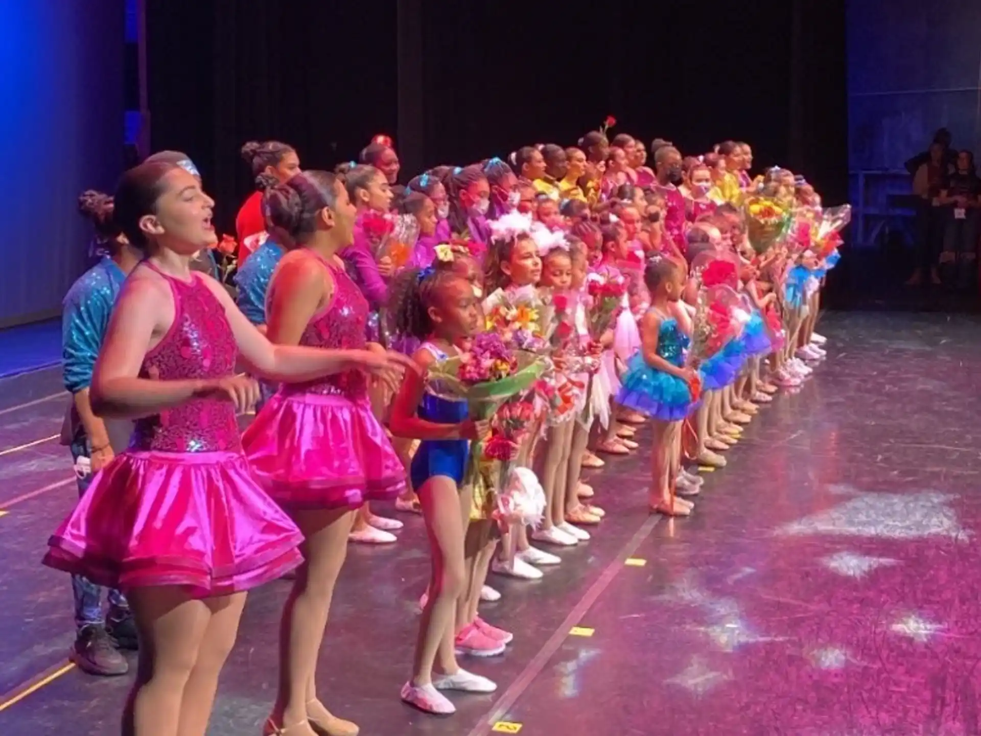 a group of women dancing on a stage