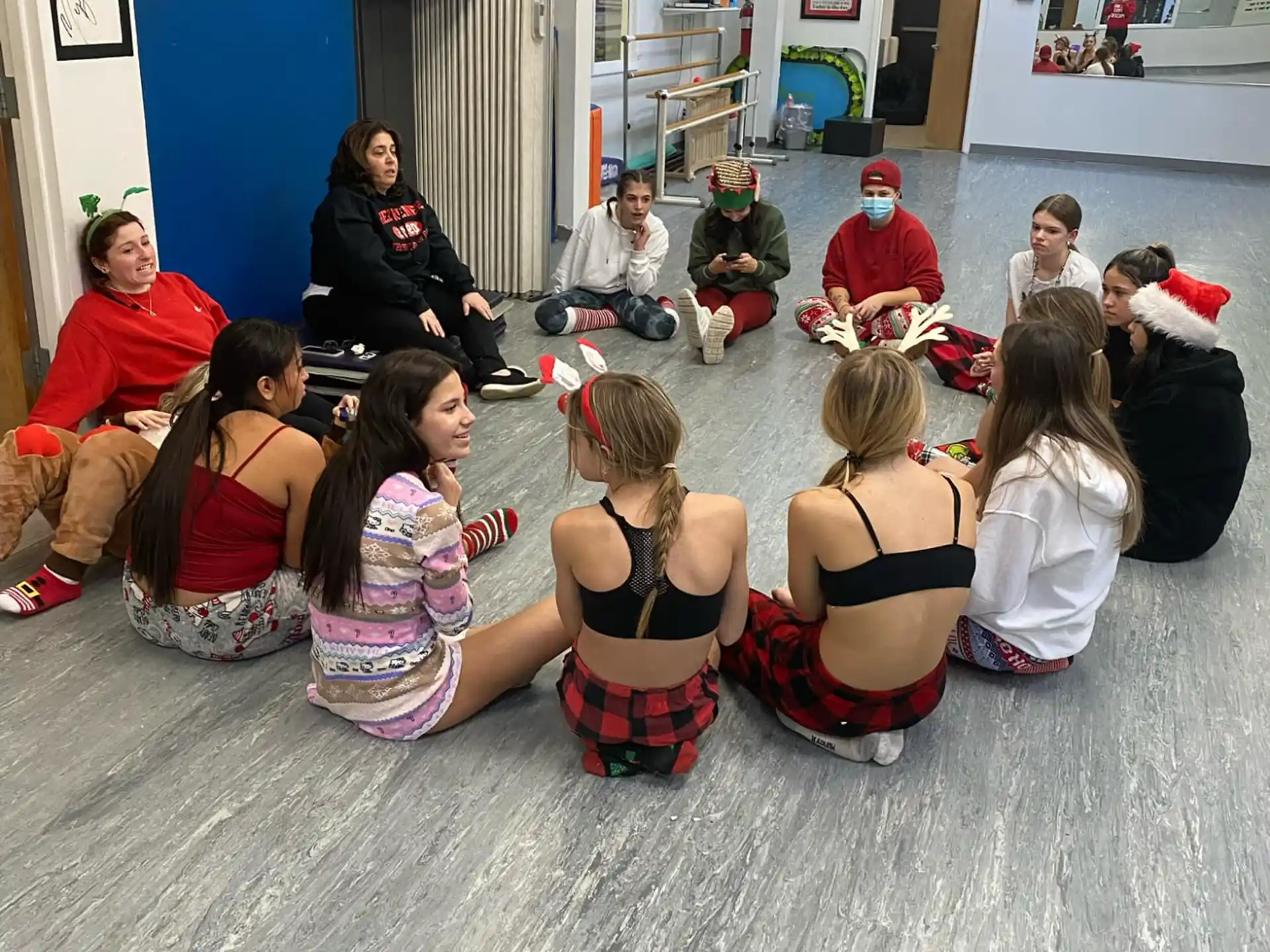 a group of people sitting on the floor