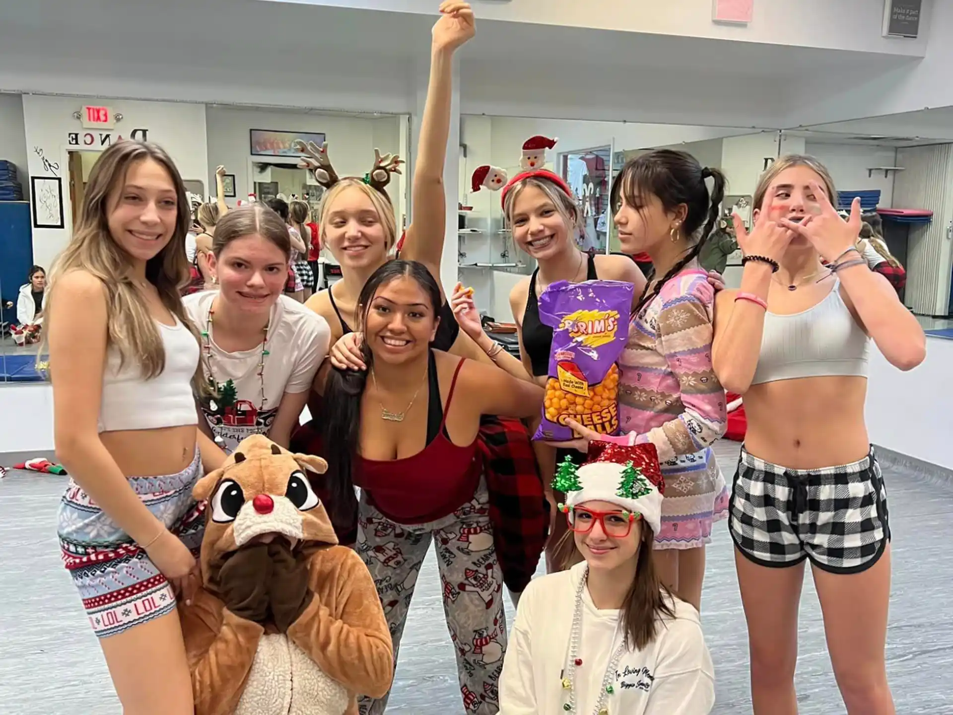a group of women posing for a photo