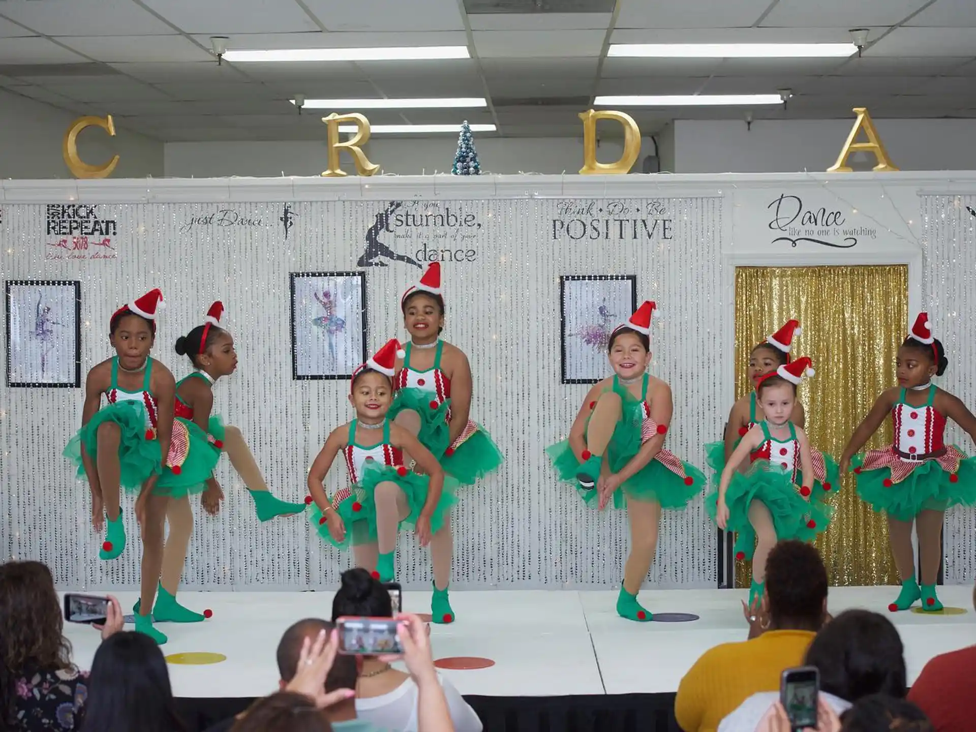 a group of girls in clothing on a stage