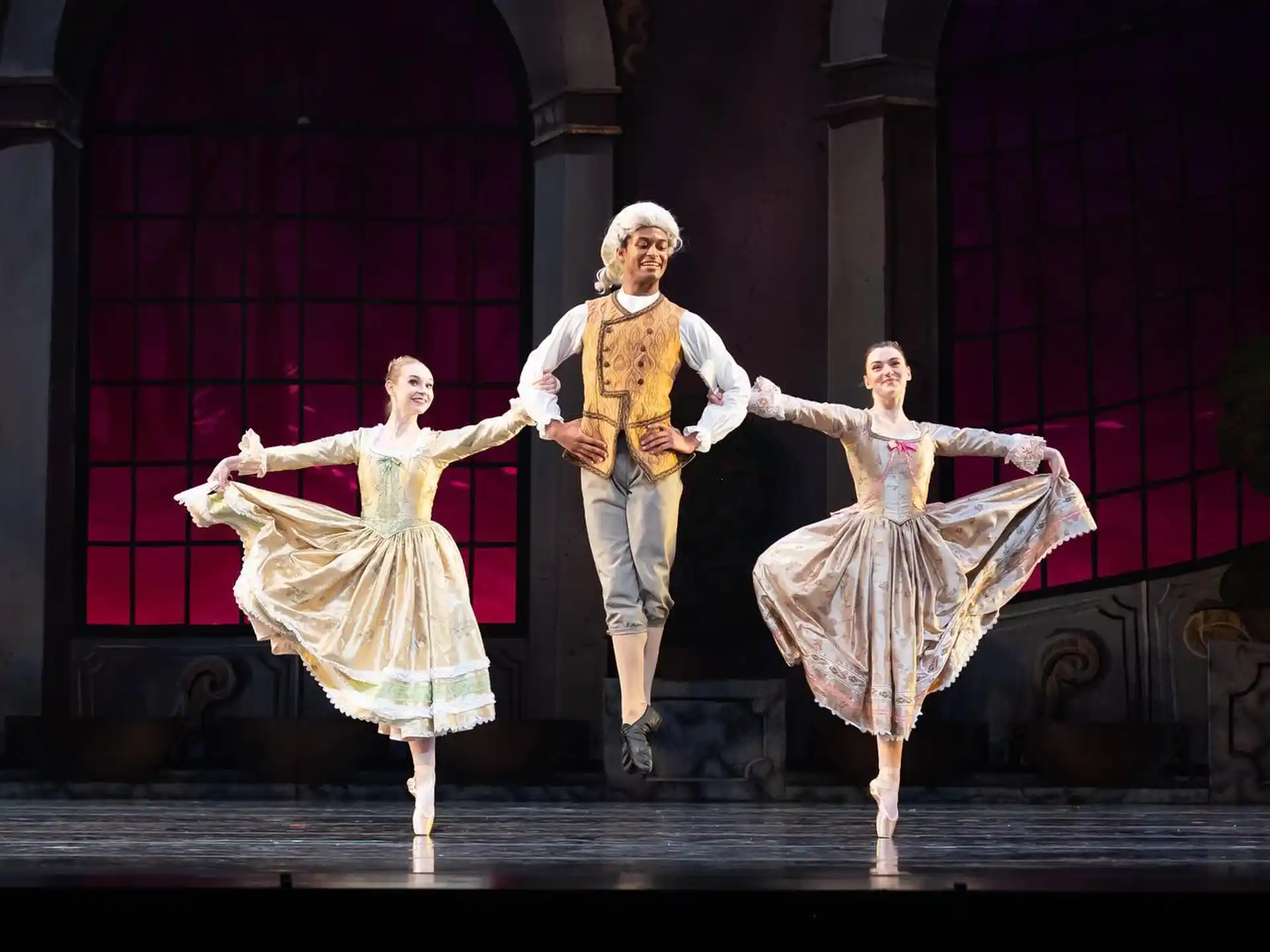 a man and woman dancing on a stage