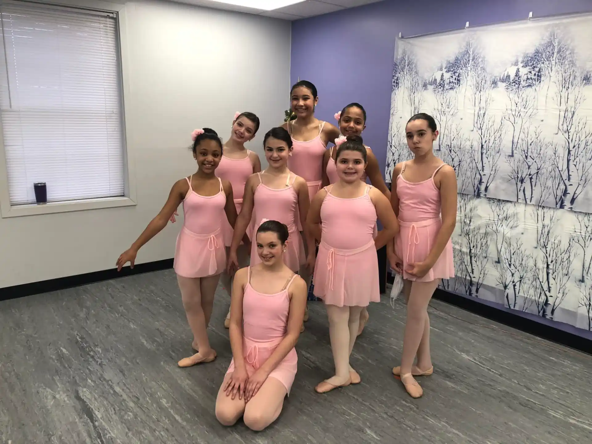 a group of women in pink dresses