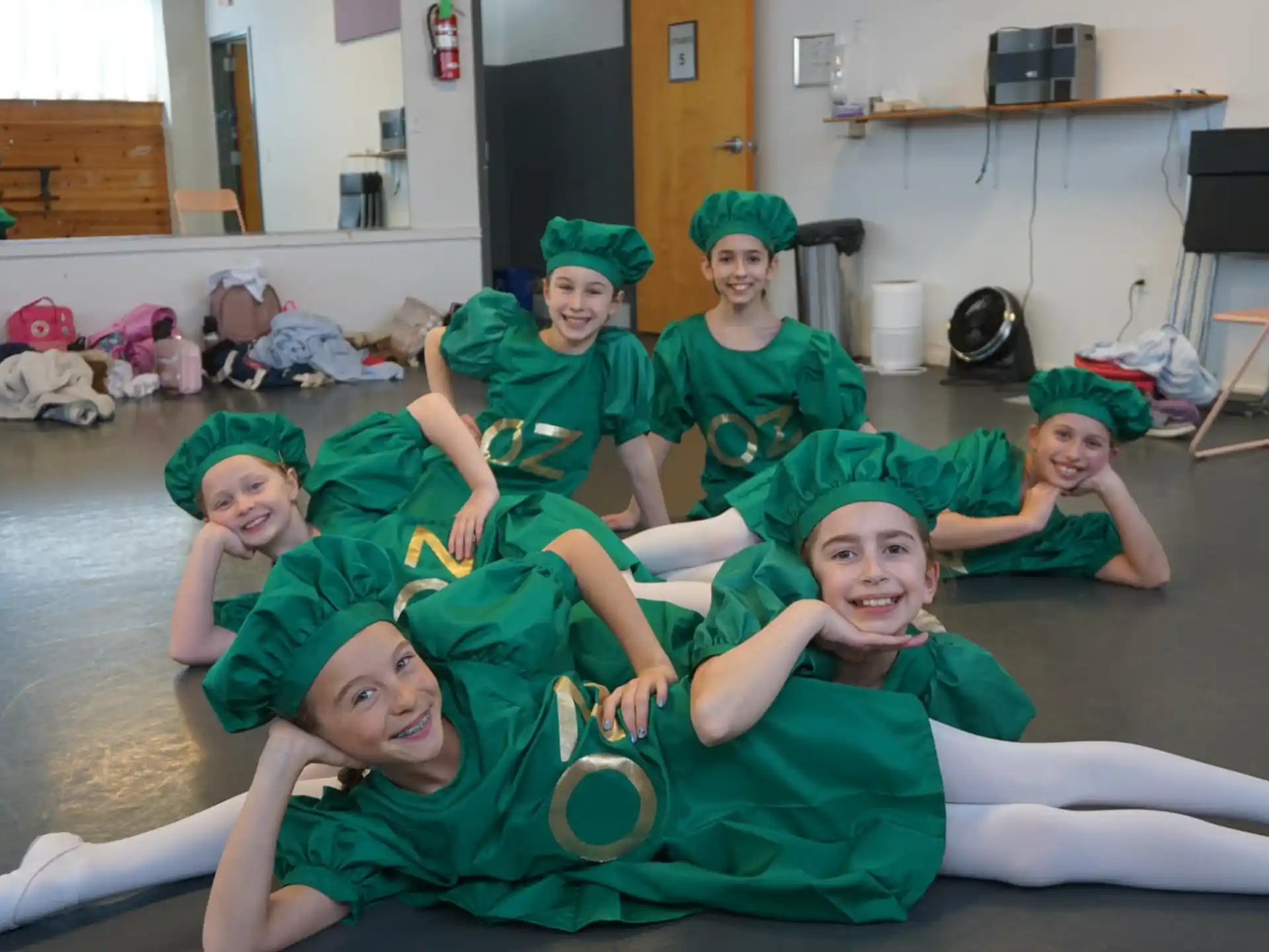 a group of people in green uniforms