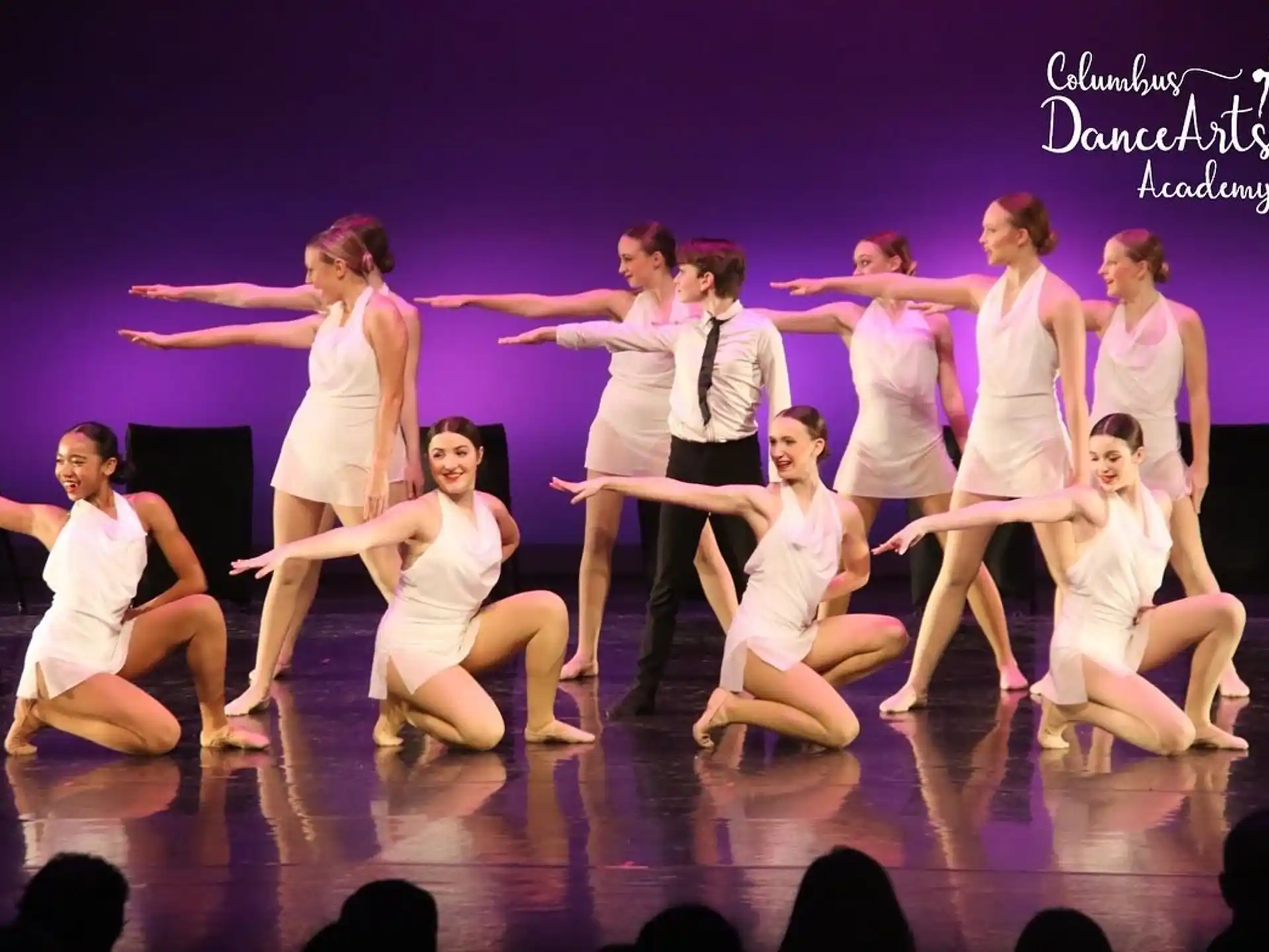 a group of women dancing on a stage