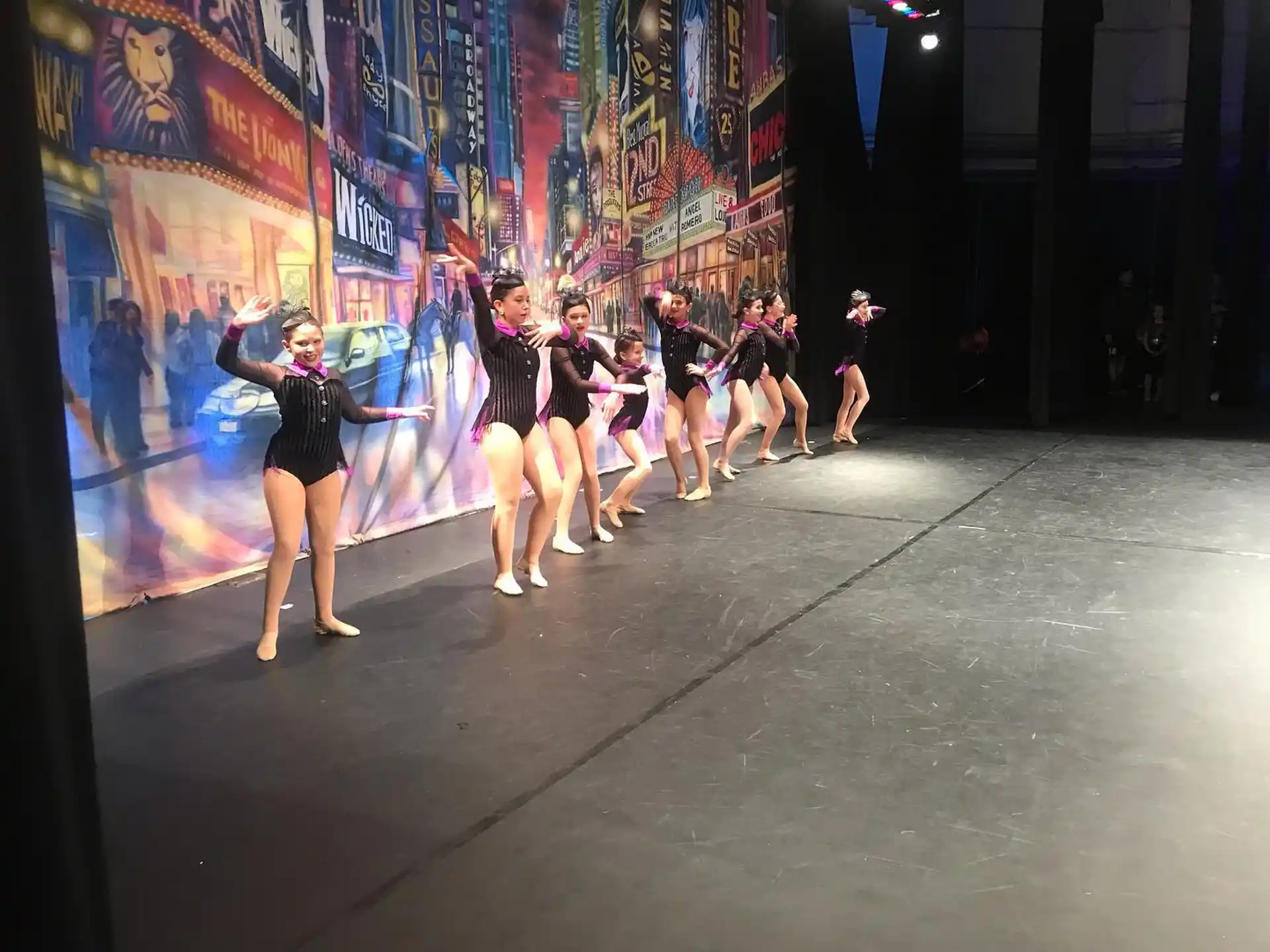 a group of women dancing on a stage