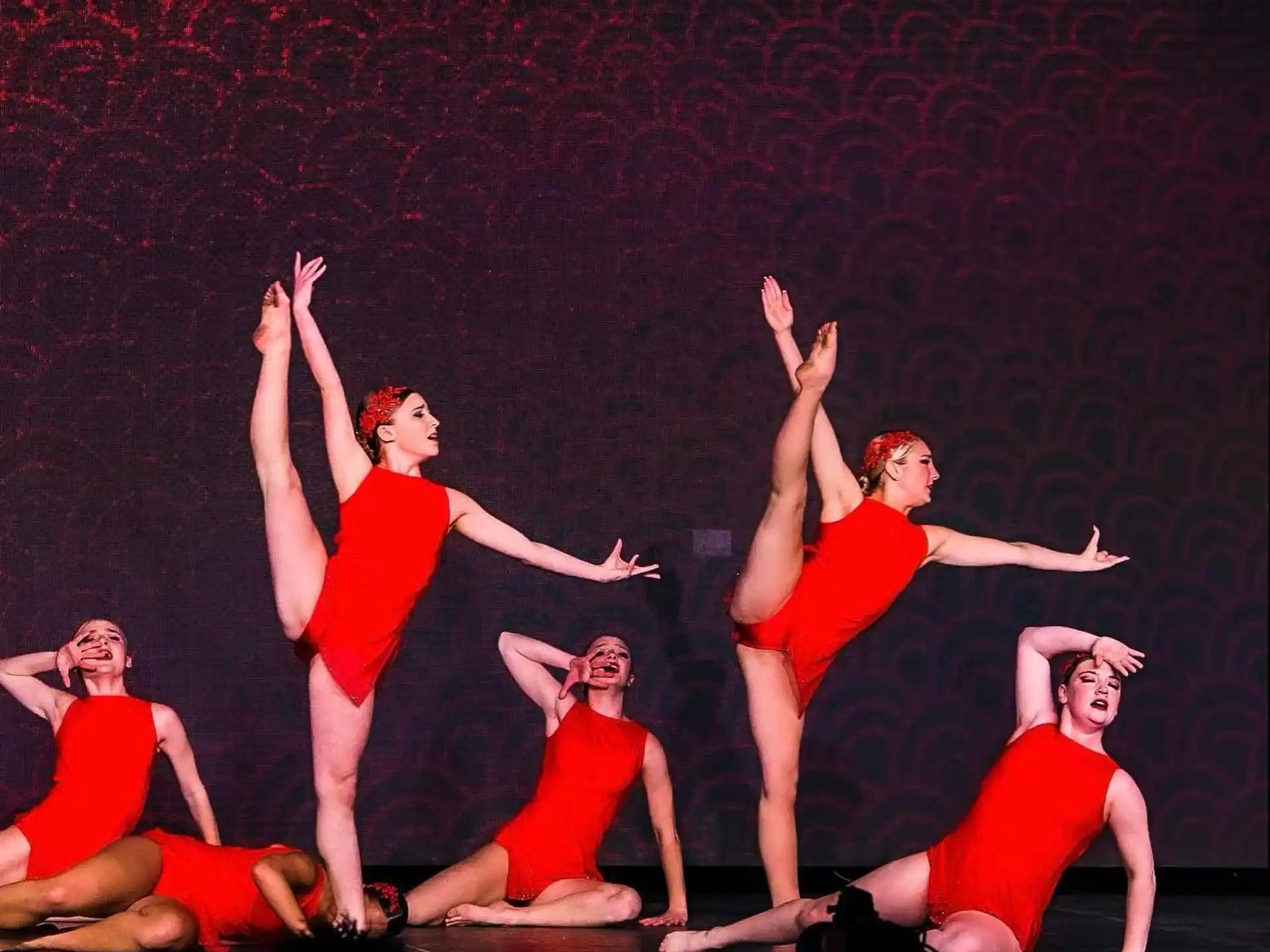a group of women dancing on a stage