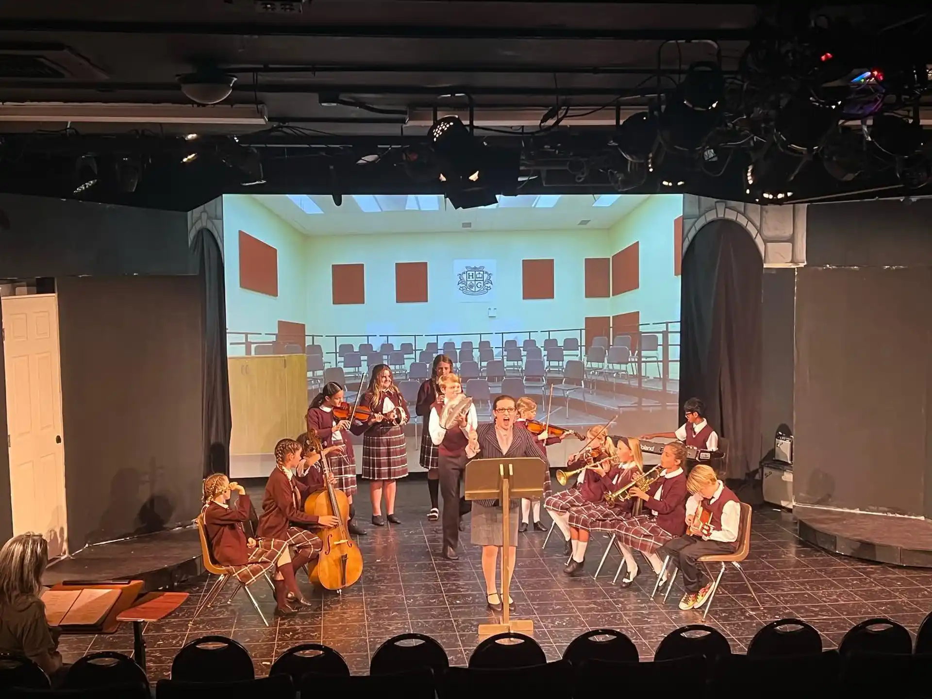 a group of people playing instruments on a stage