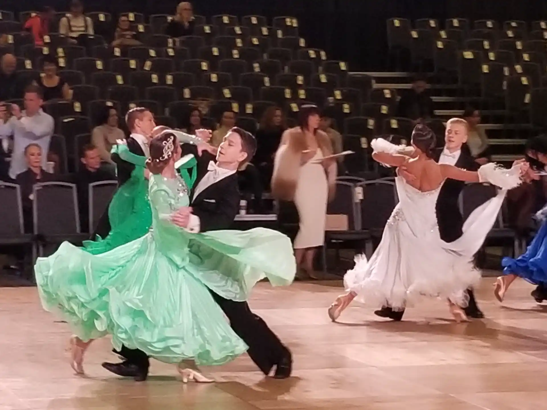 a group of people dancing on a stage