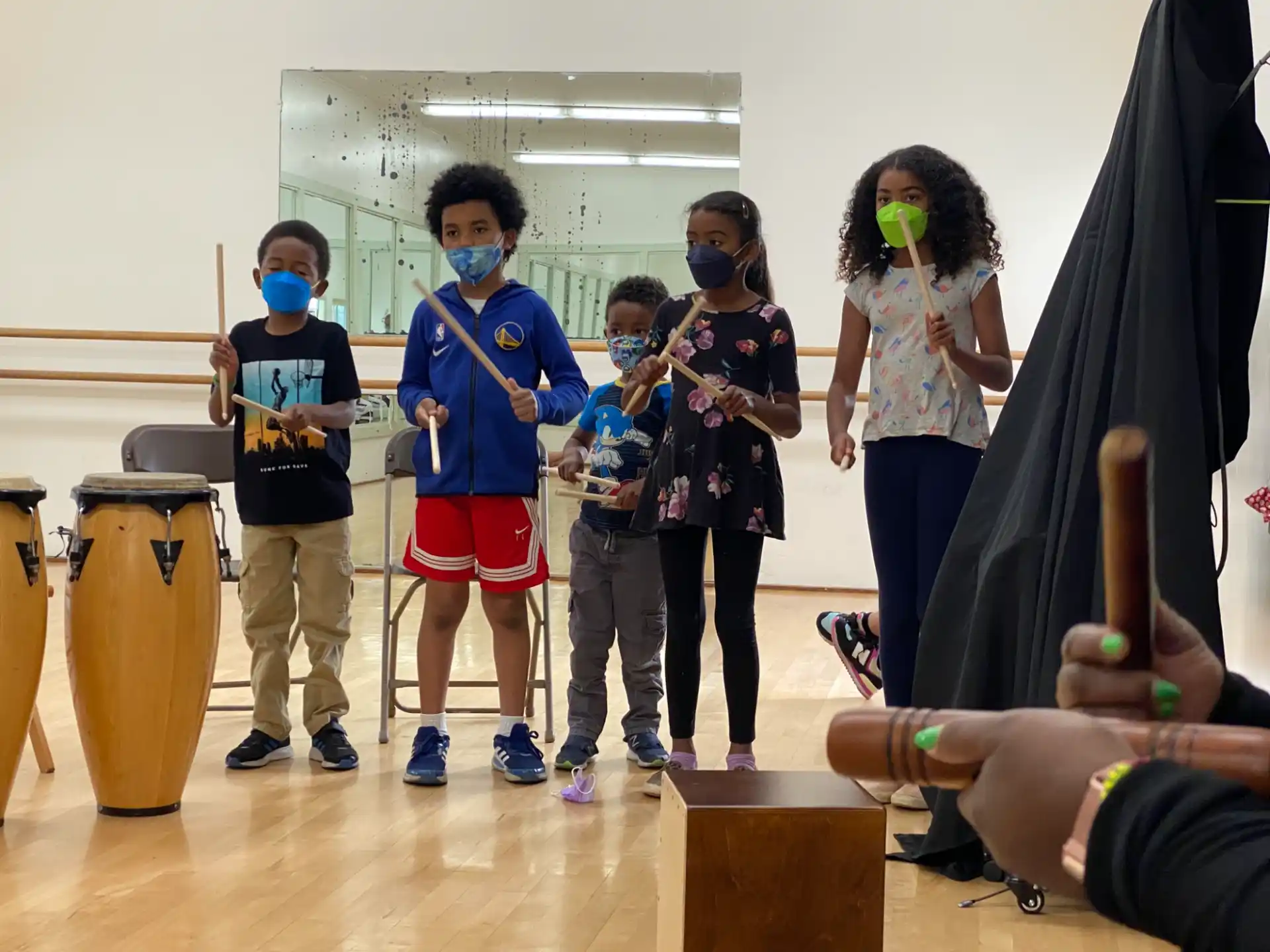 a group of kids wearing masks