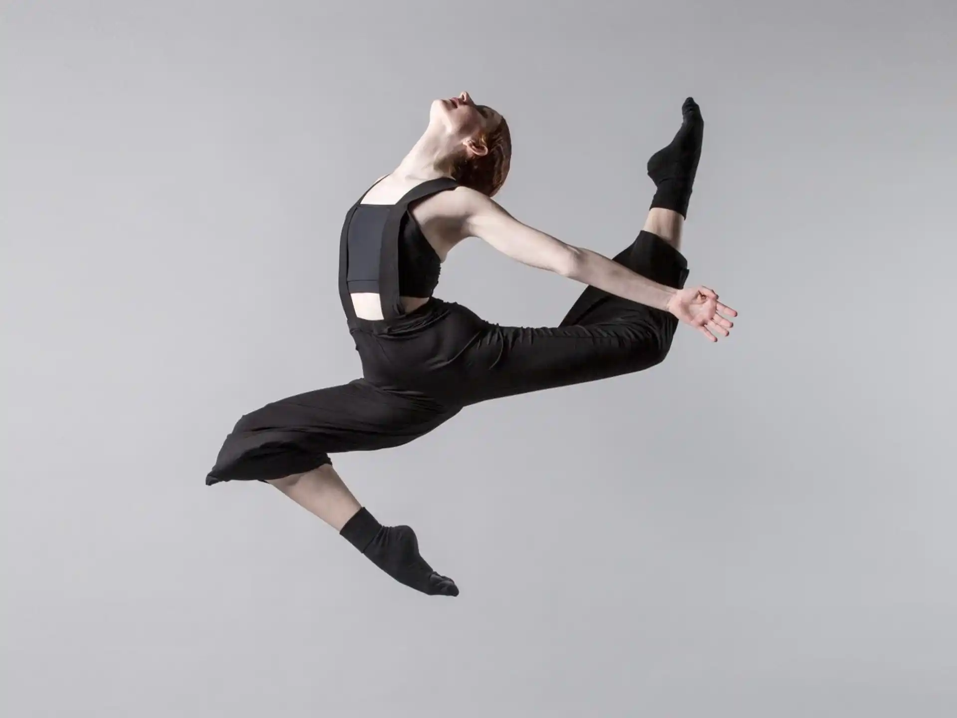 a person in a black outfit
