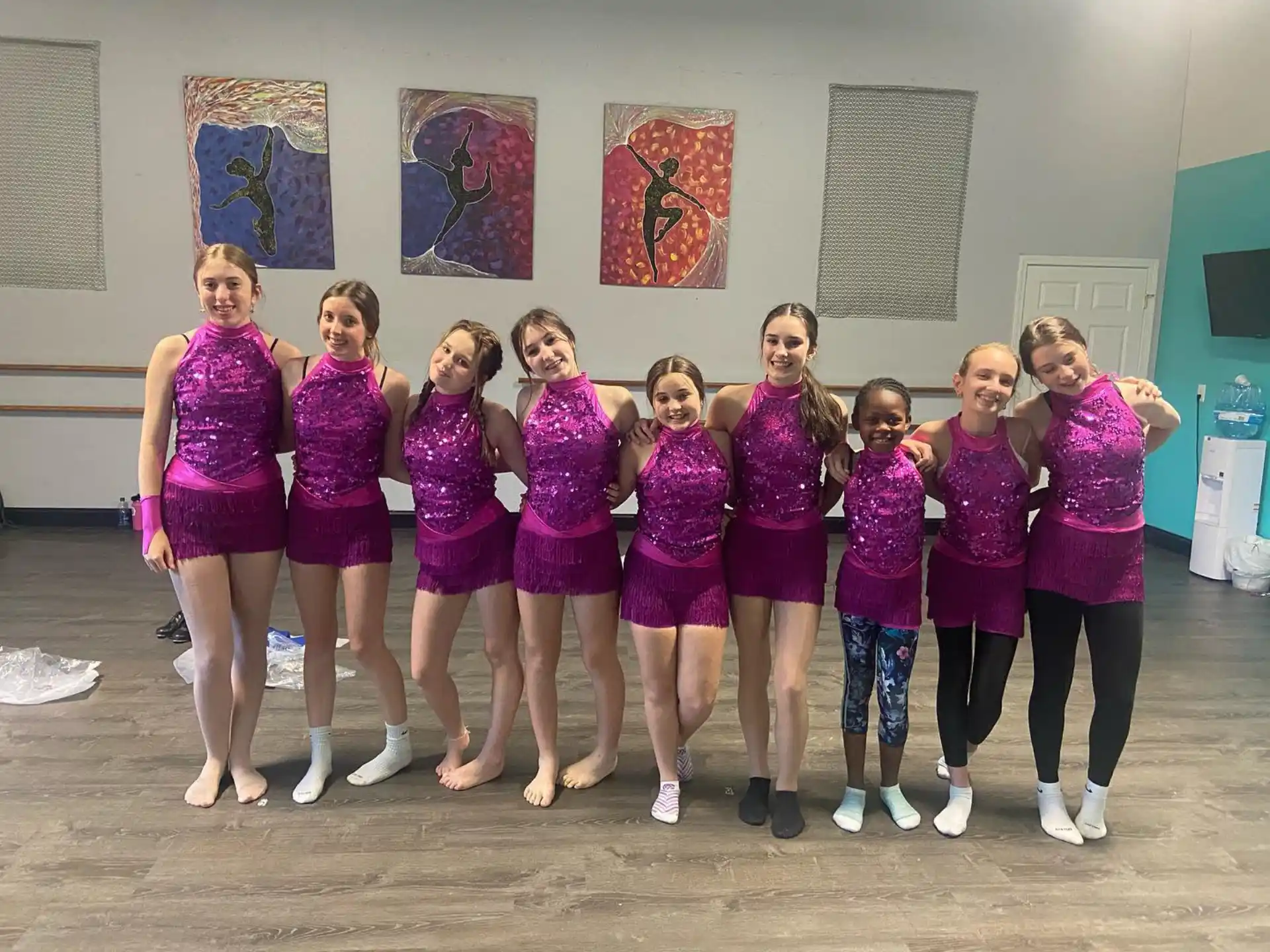 a group of women in matching outfits