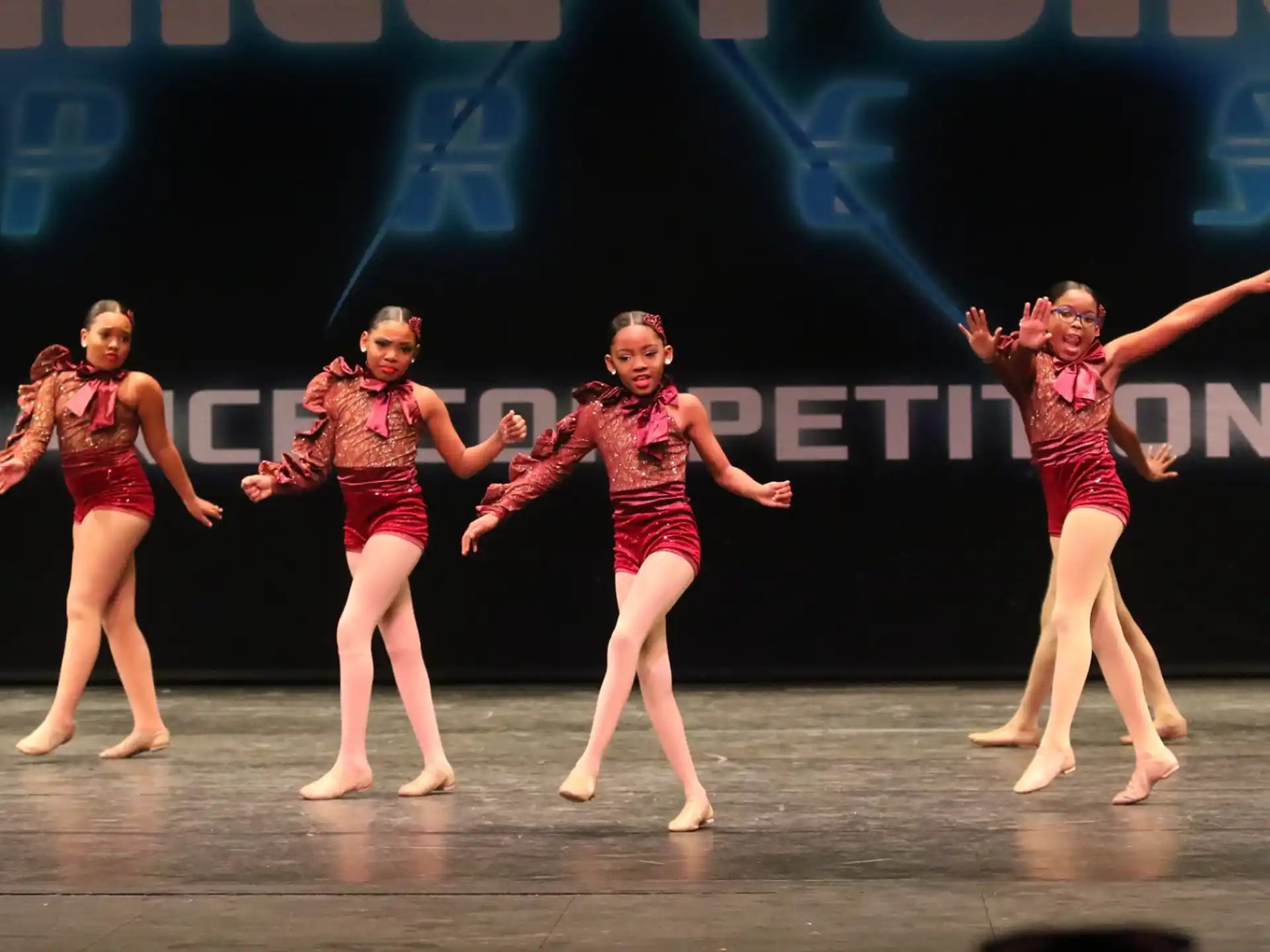 a group of women dancing on a stage