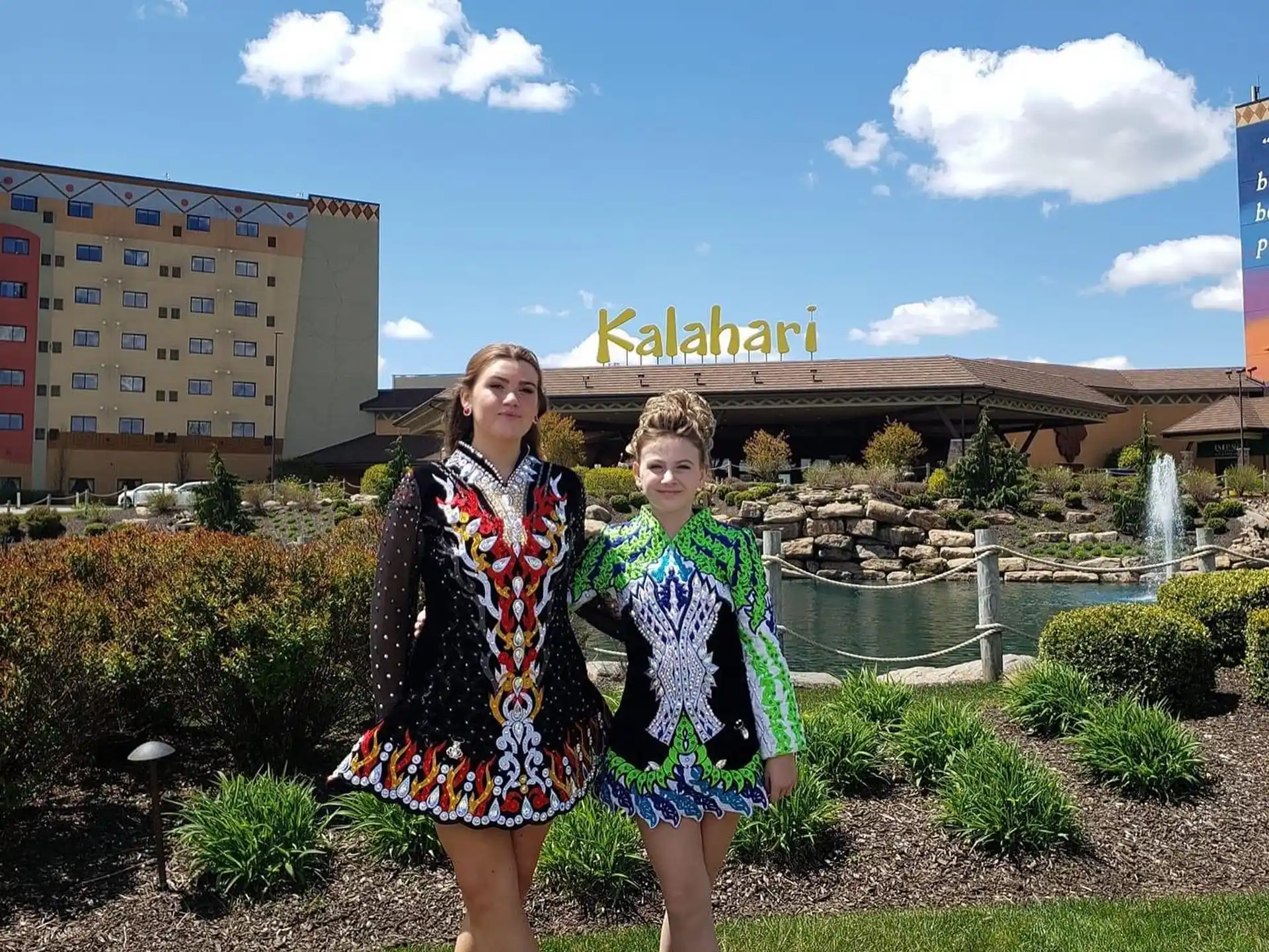 two girls standing in a garden