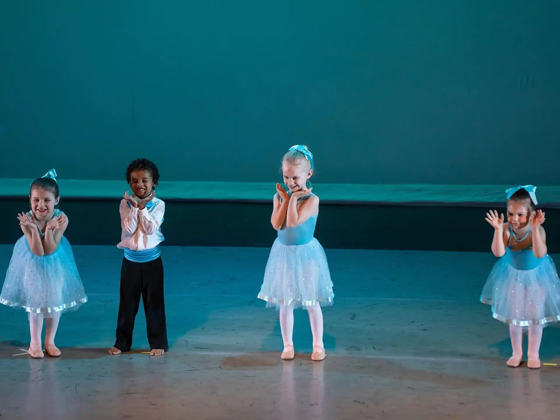 a group of children on a stage