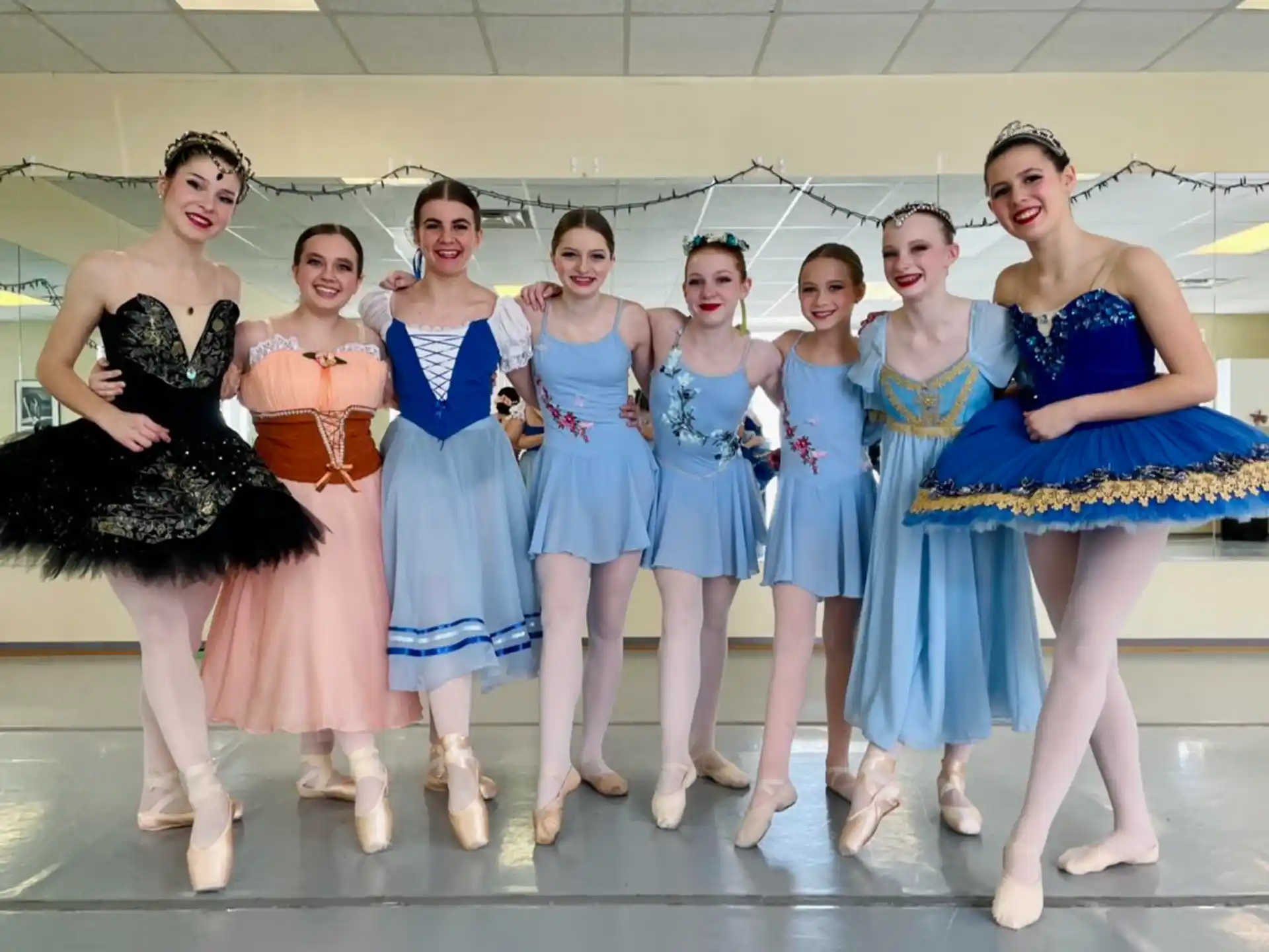 a group of women in blue dresses