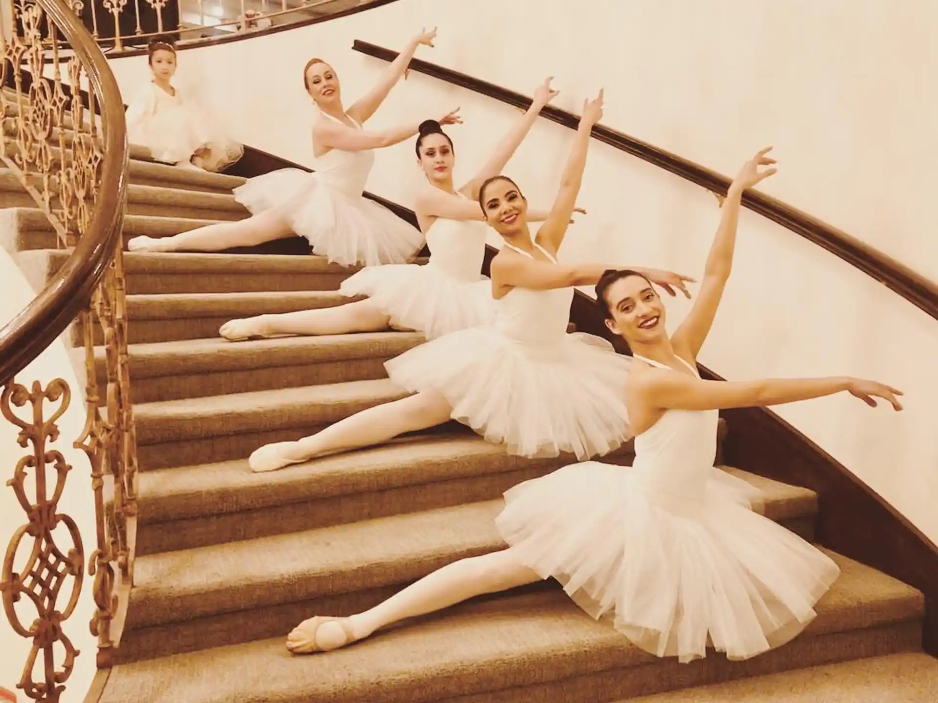 a group of people in white dresses