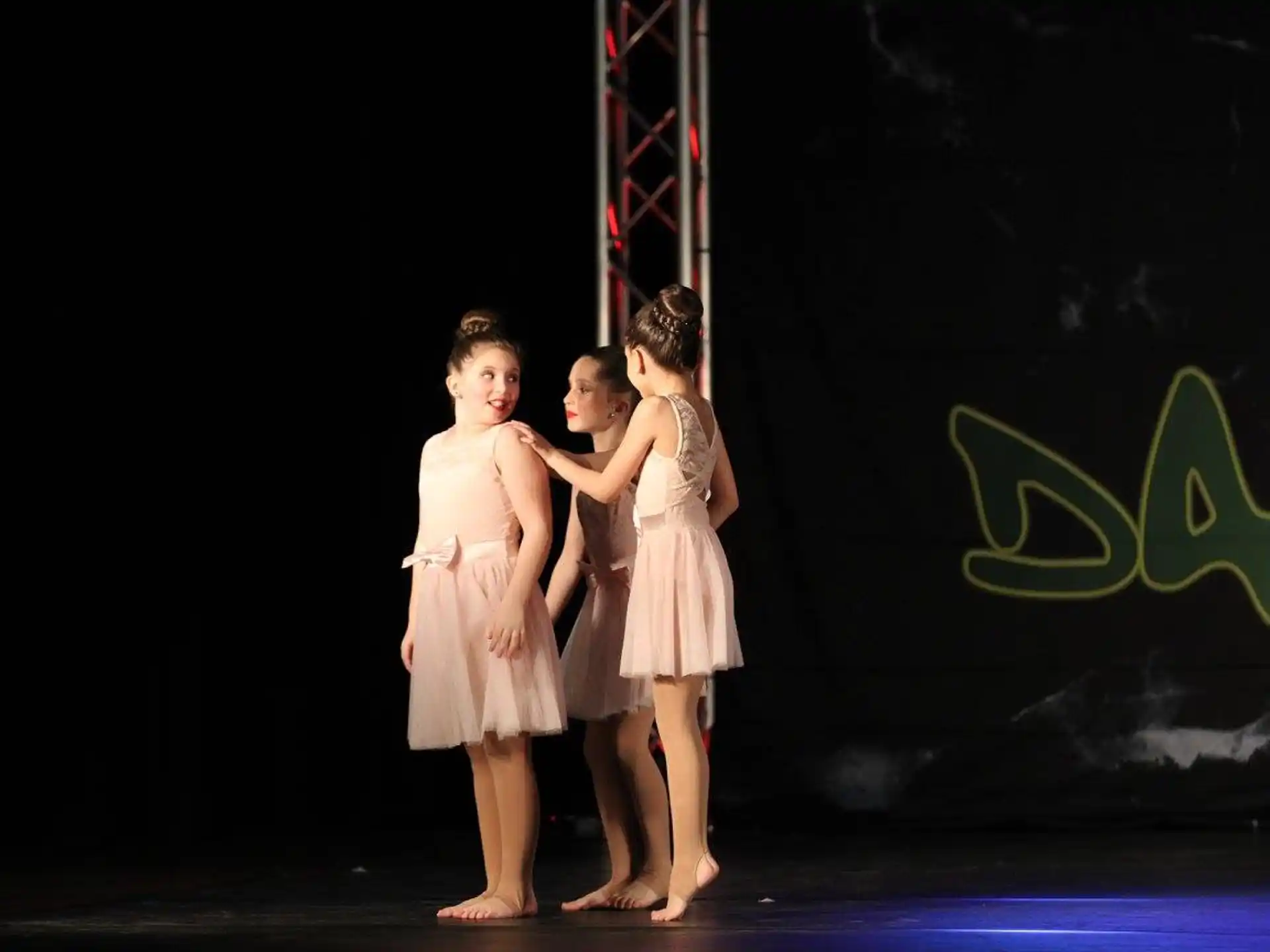 a group of girls on a stage