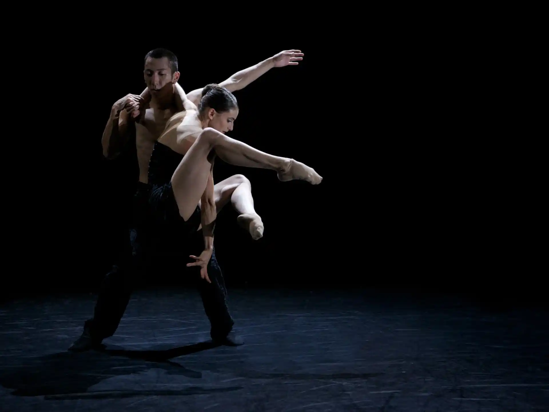 a man and woman dancing