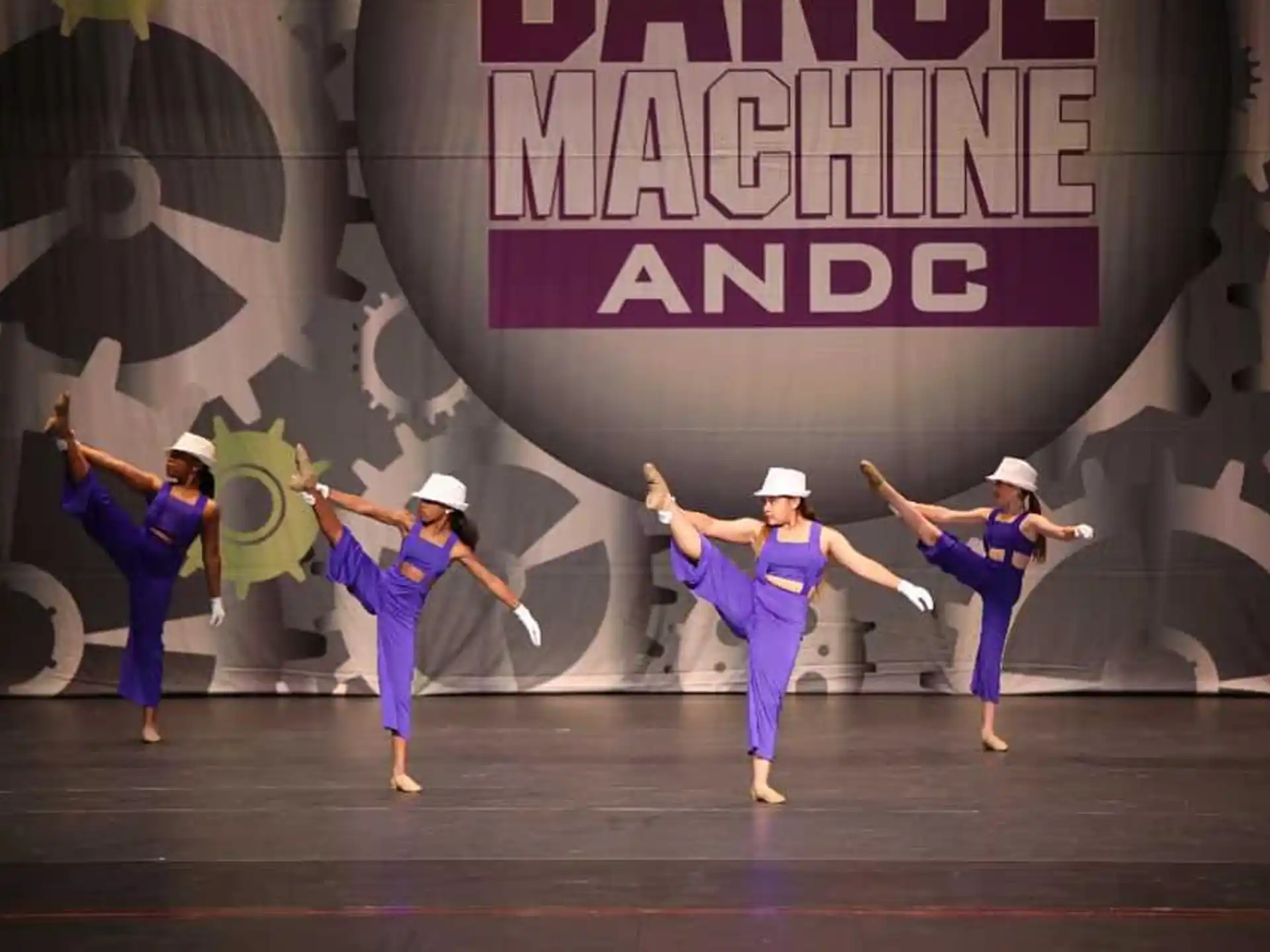 a group of people dancing on a stage