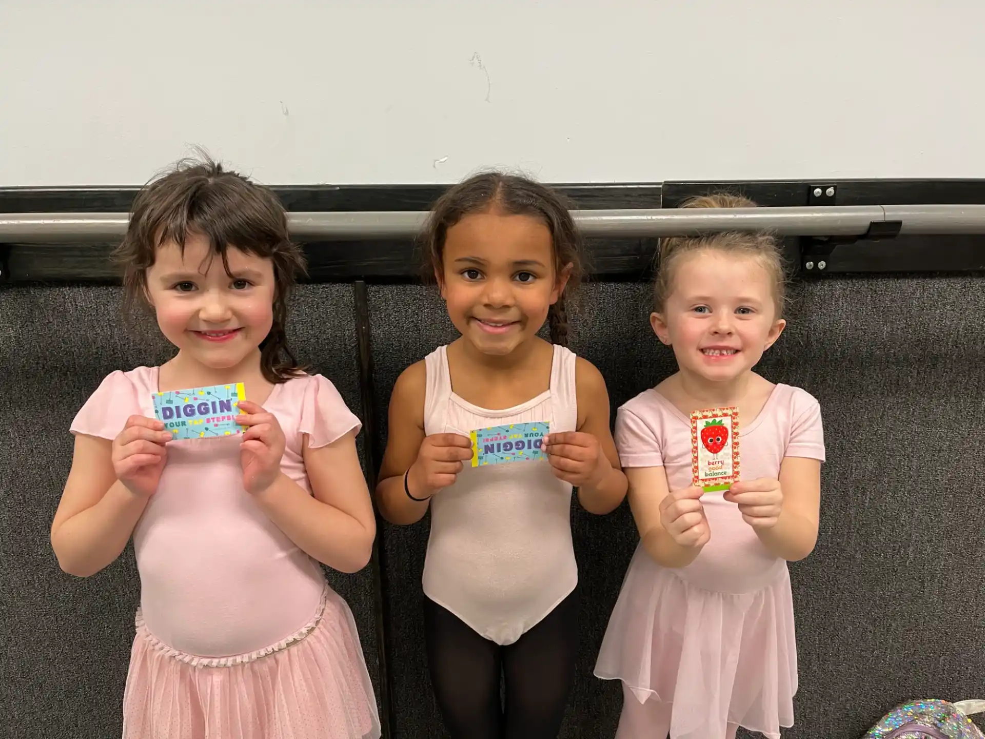 a group of girls holding cups