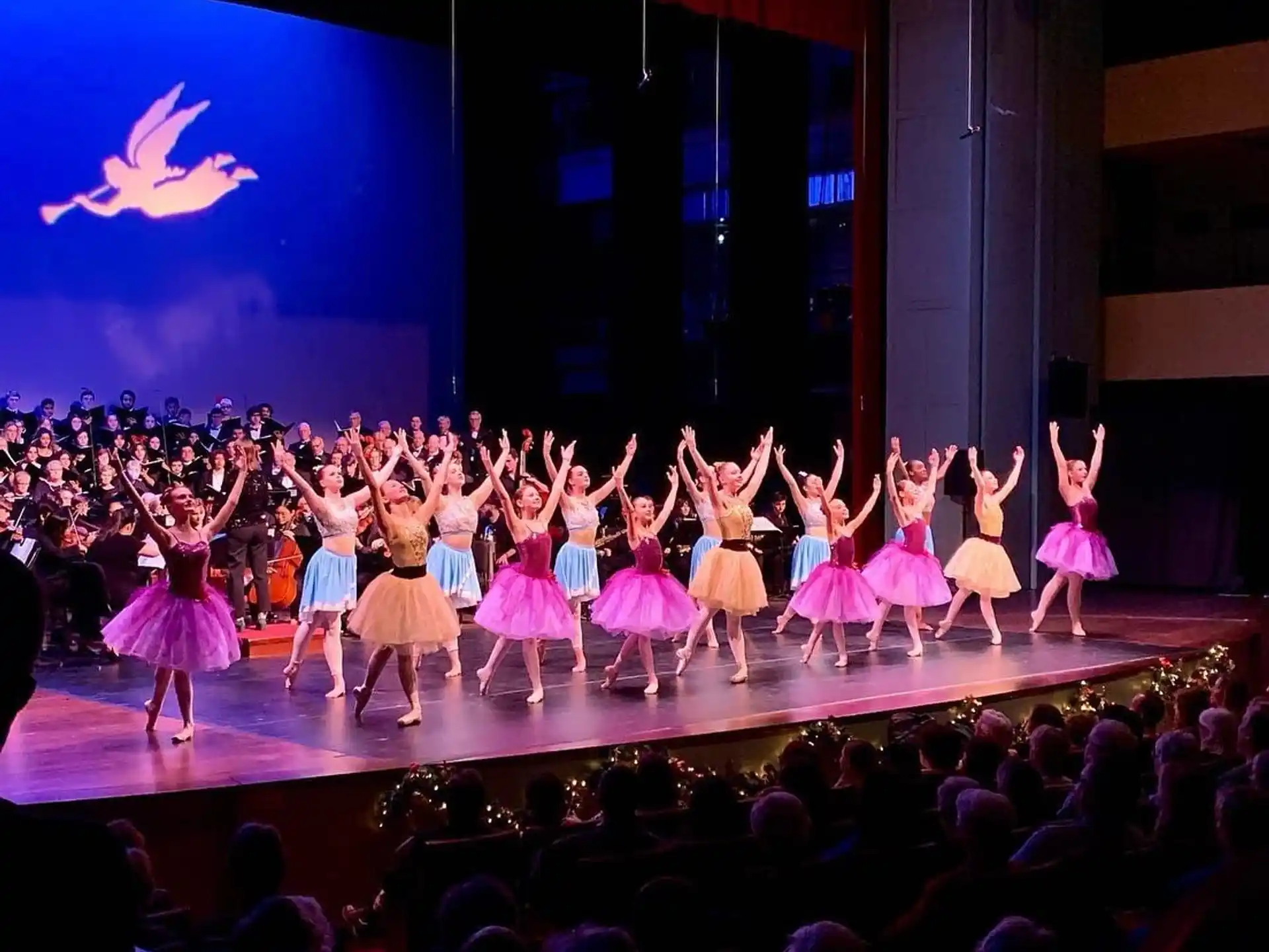 a group of people dancing on a stage