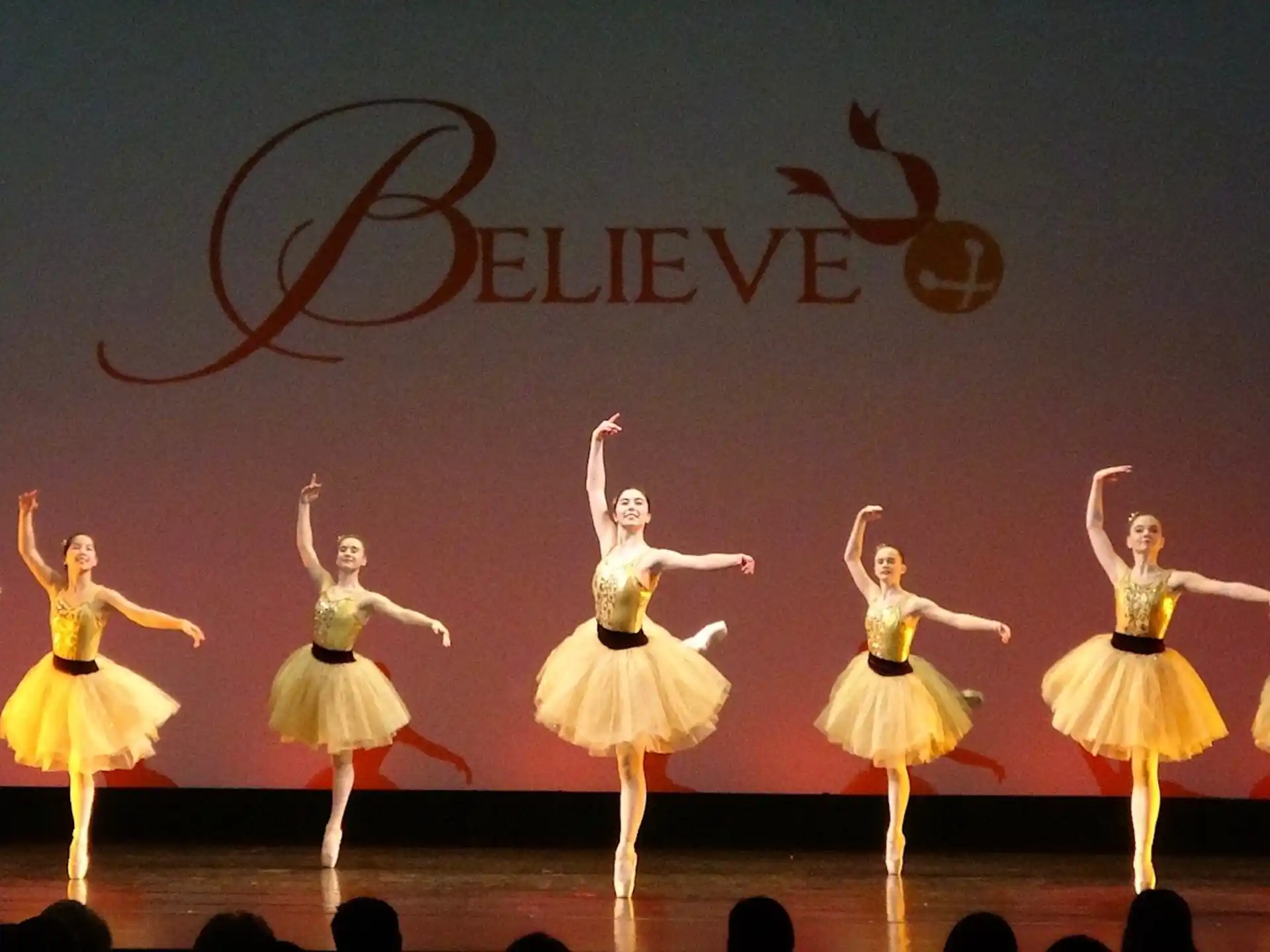 a group of women dancing on a stage