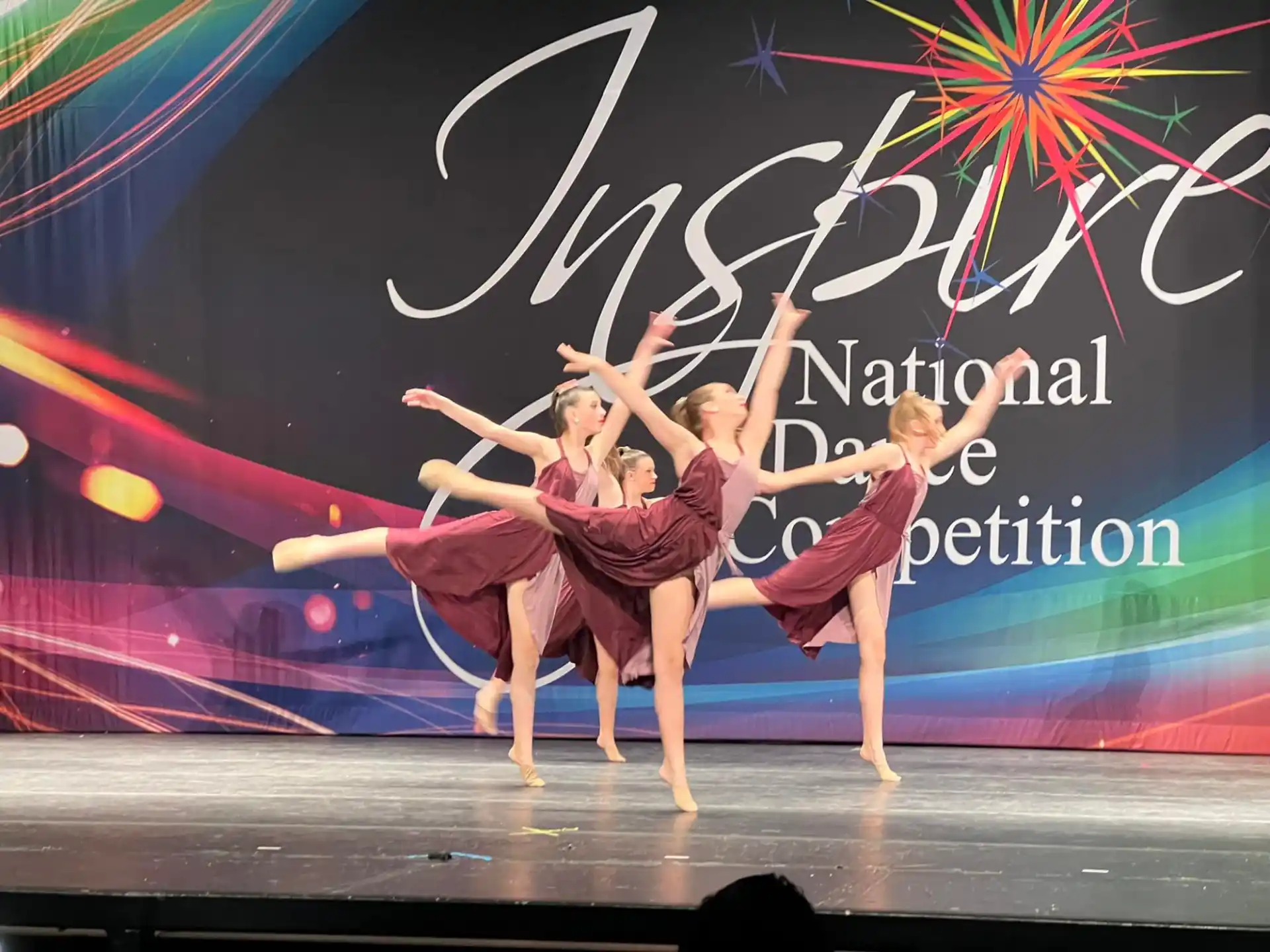 a group of women dancing on a stage