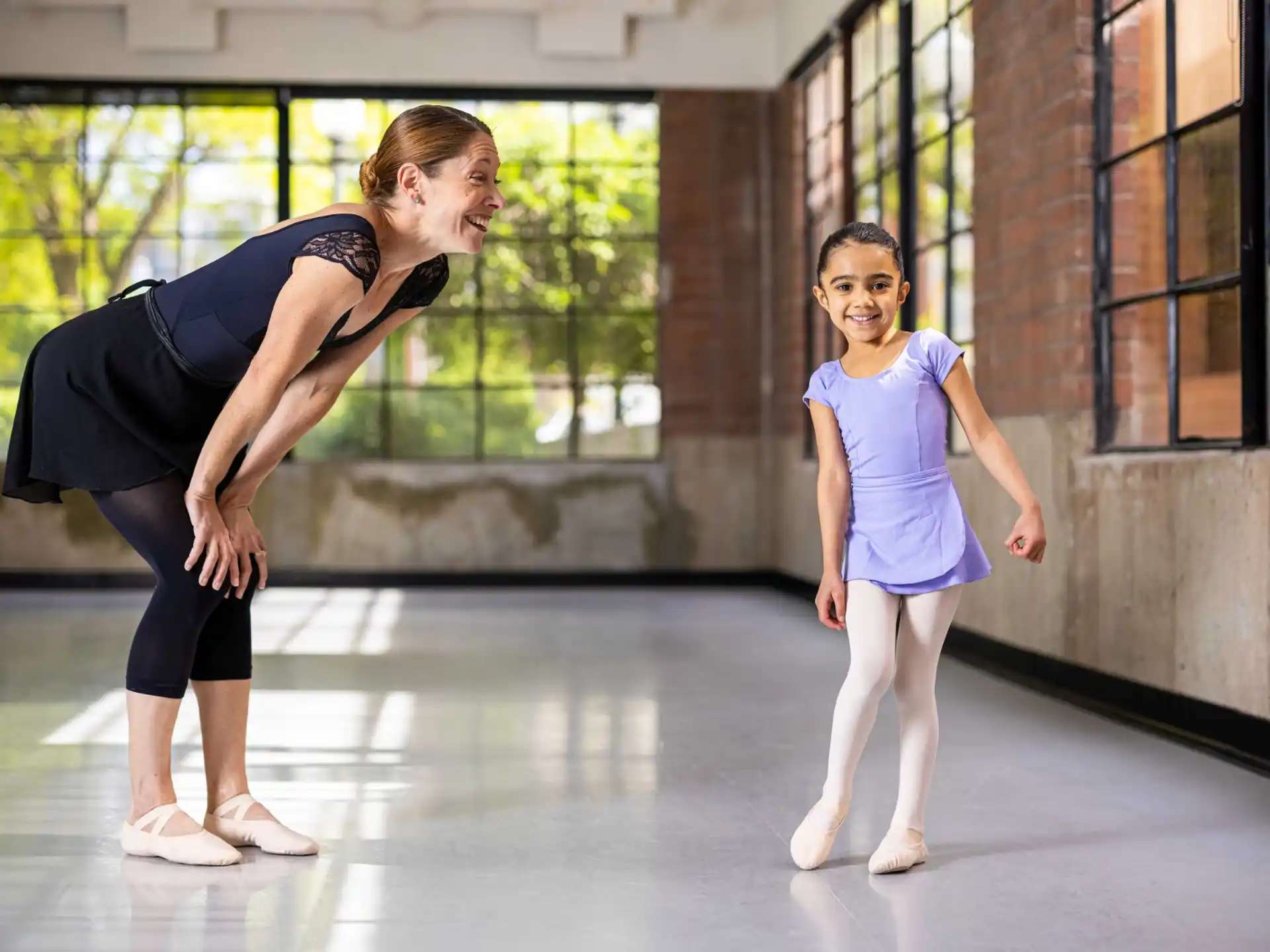 a person and a girl dancing