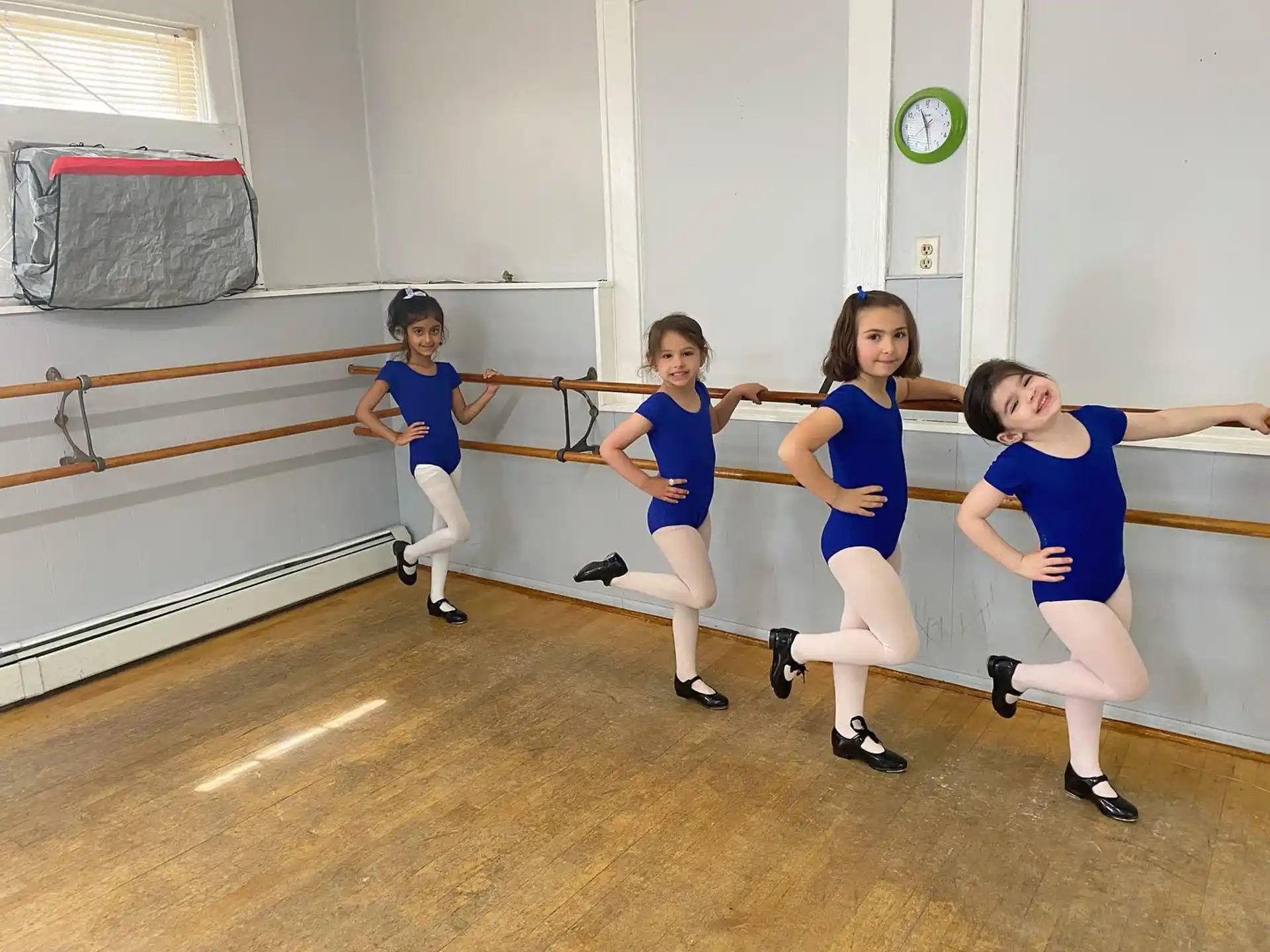 a group of girls in blue uniforms