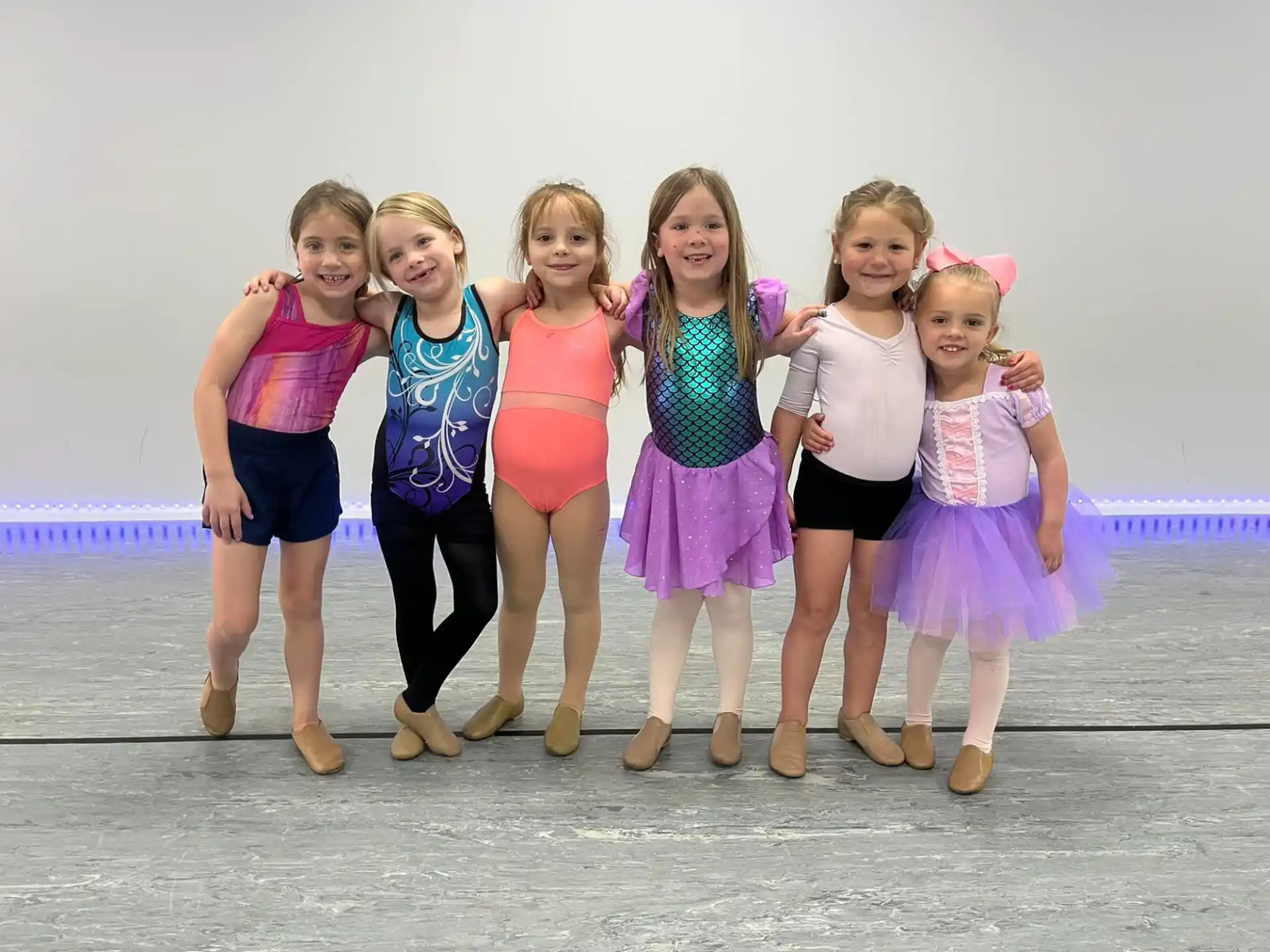 a group of girls posing for a photo