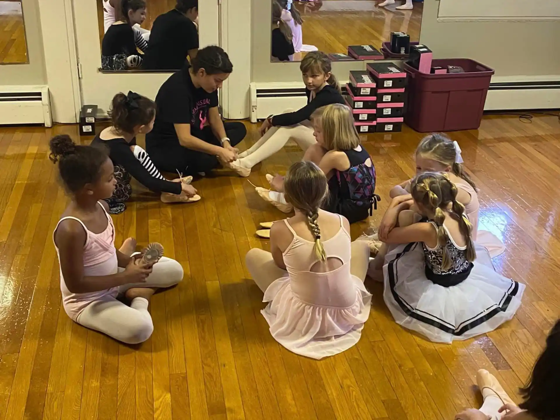 a group of people sitting on the floor