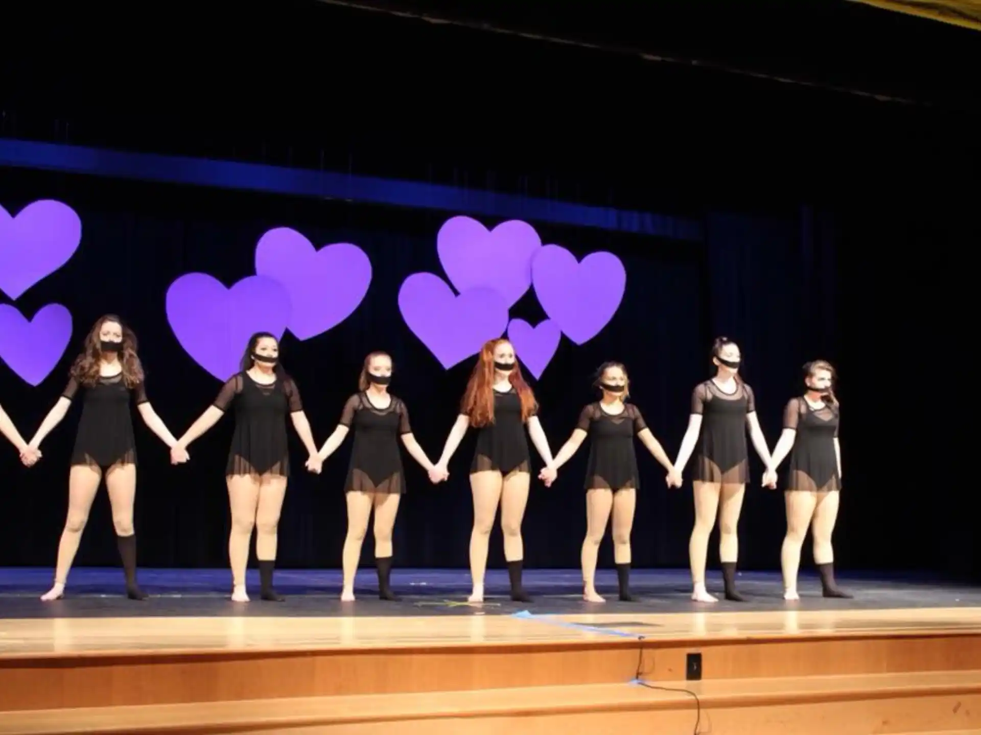 a group of girls on a stage