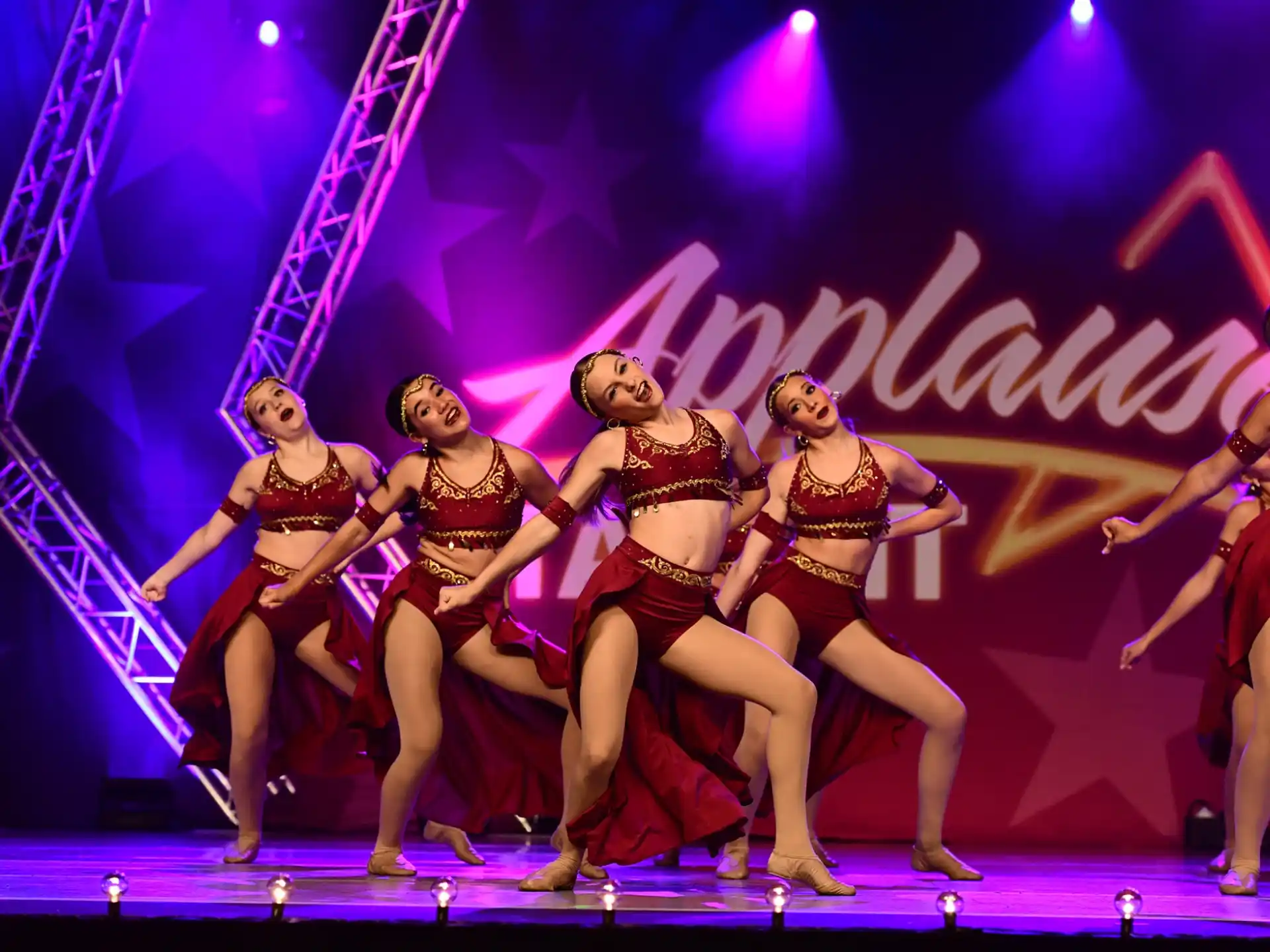 a group of women dancing on a stage