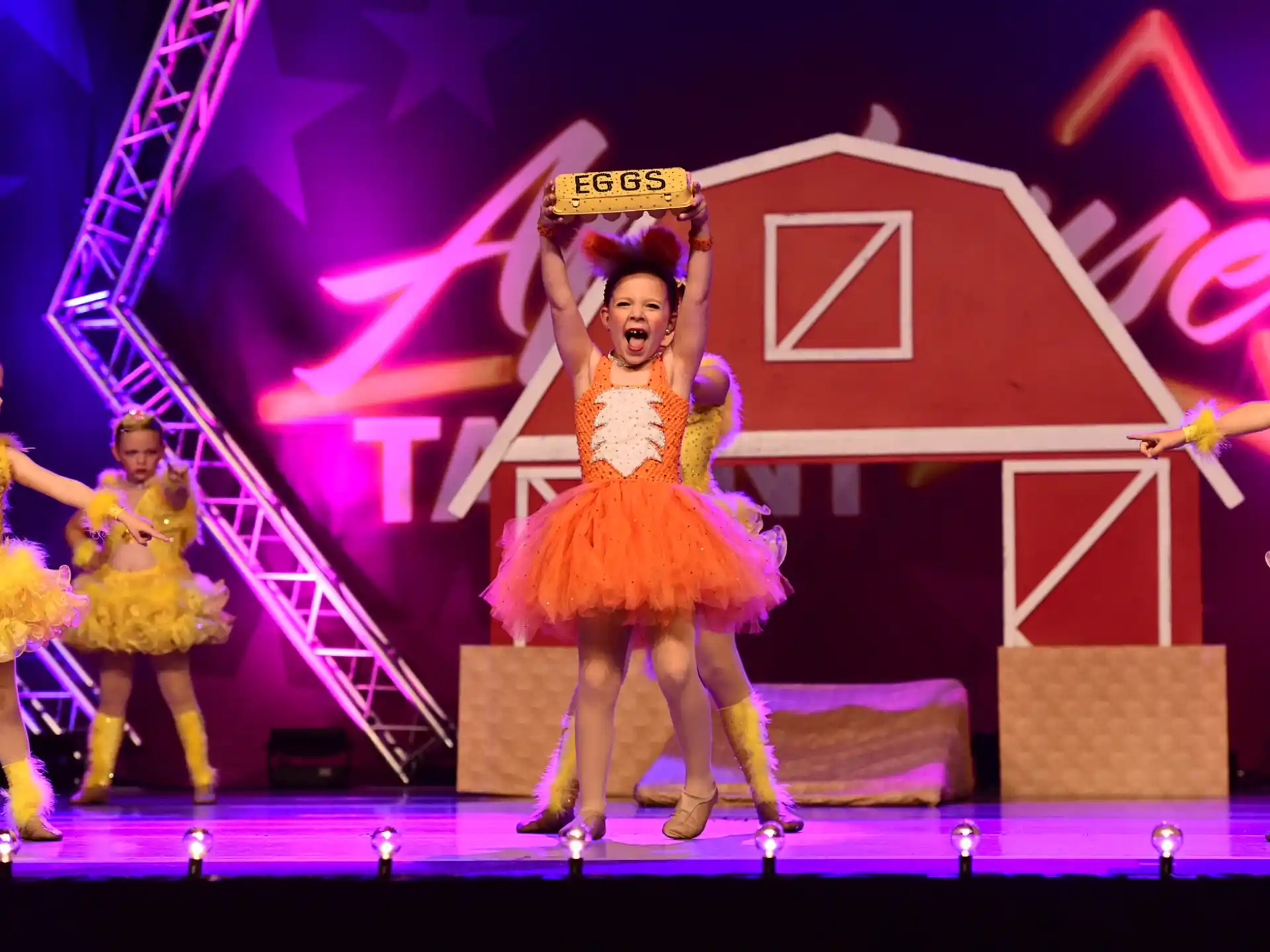 a group of women dancing on a stage