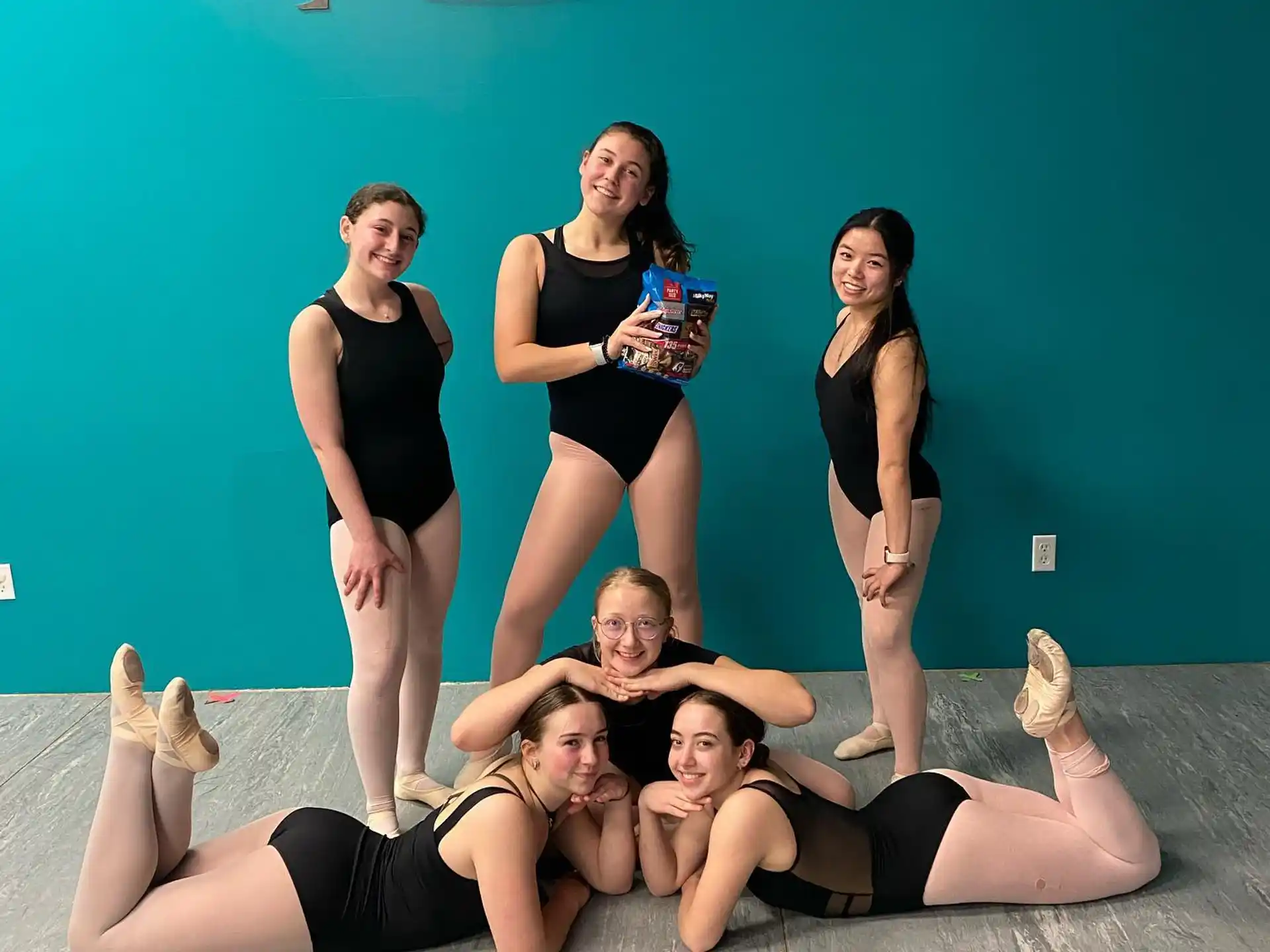 a group of women posing for a photo