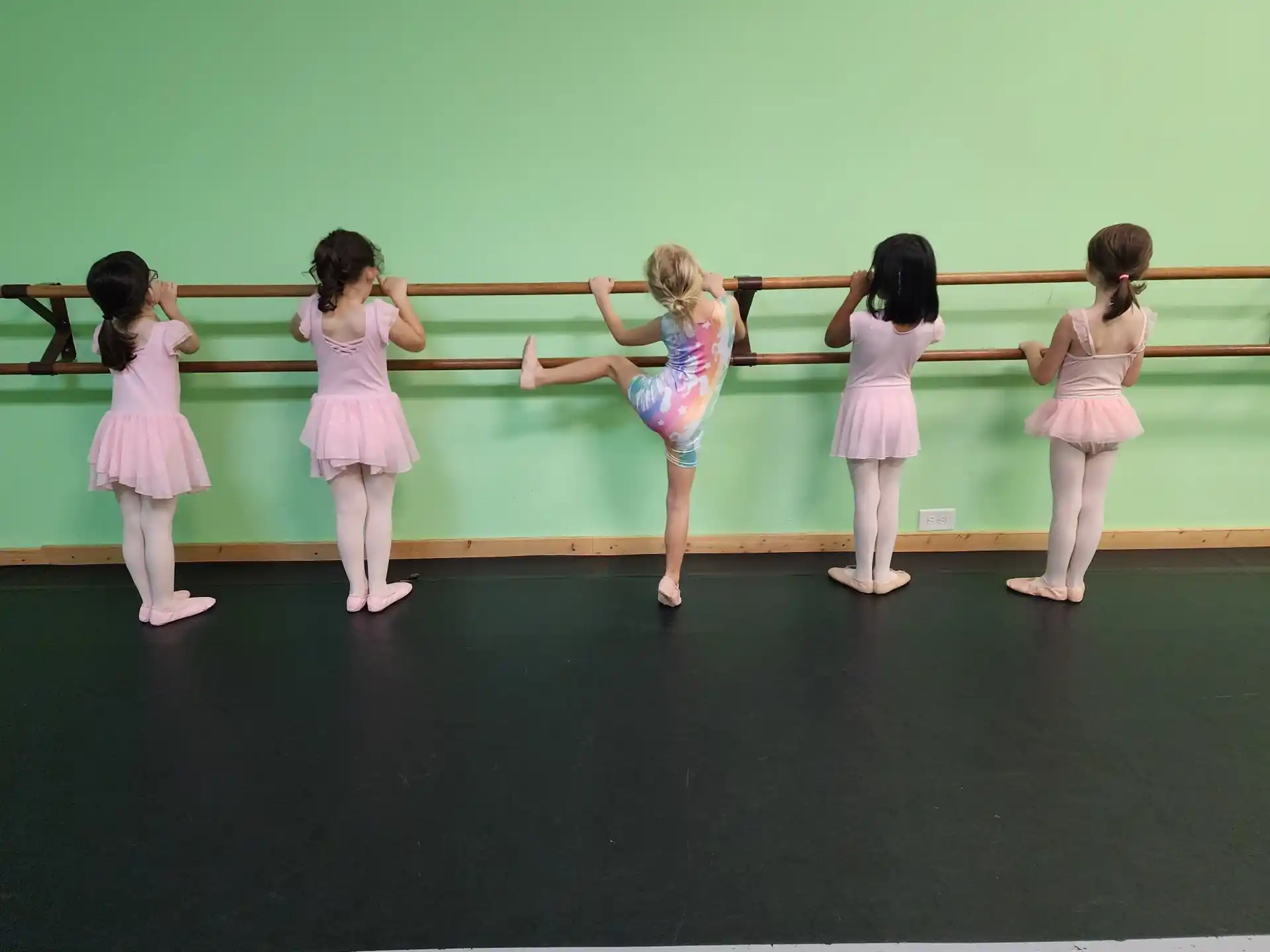 a group of girls in dresses