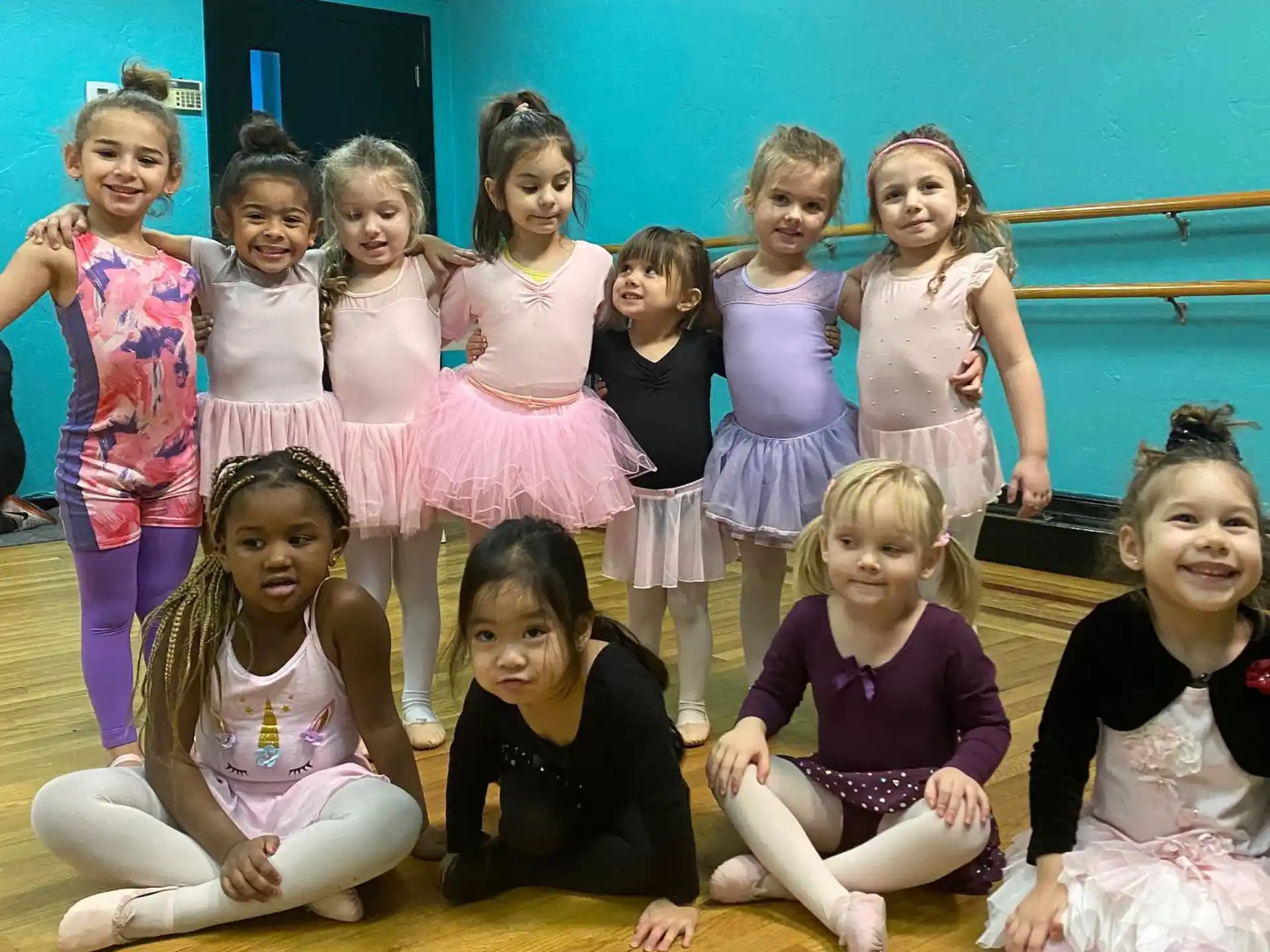 a group of girls posing for a photo