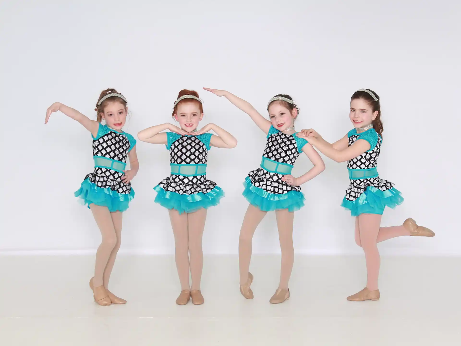 a group of girls wearing matching outfits