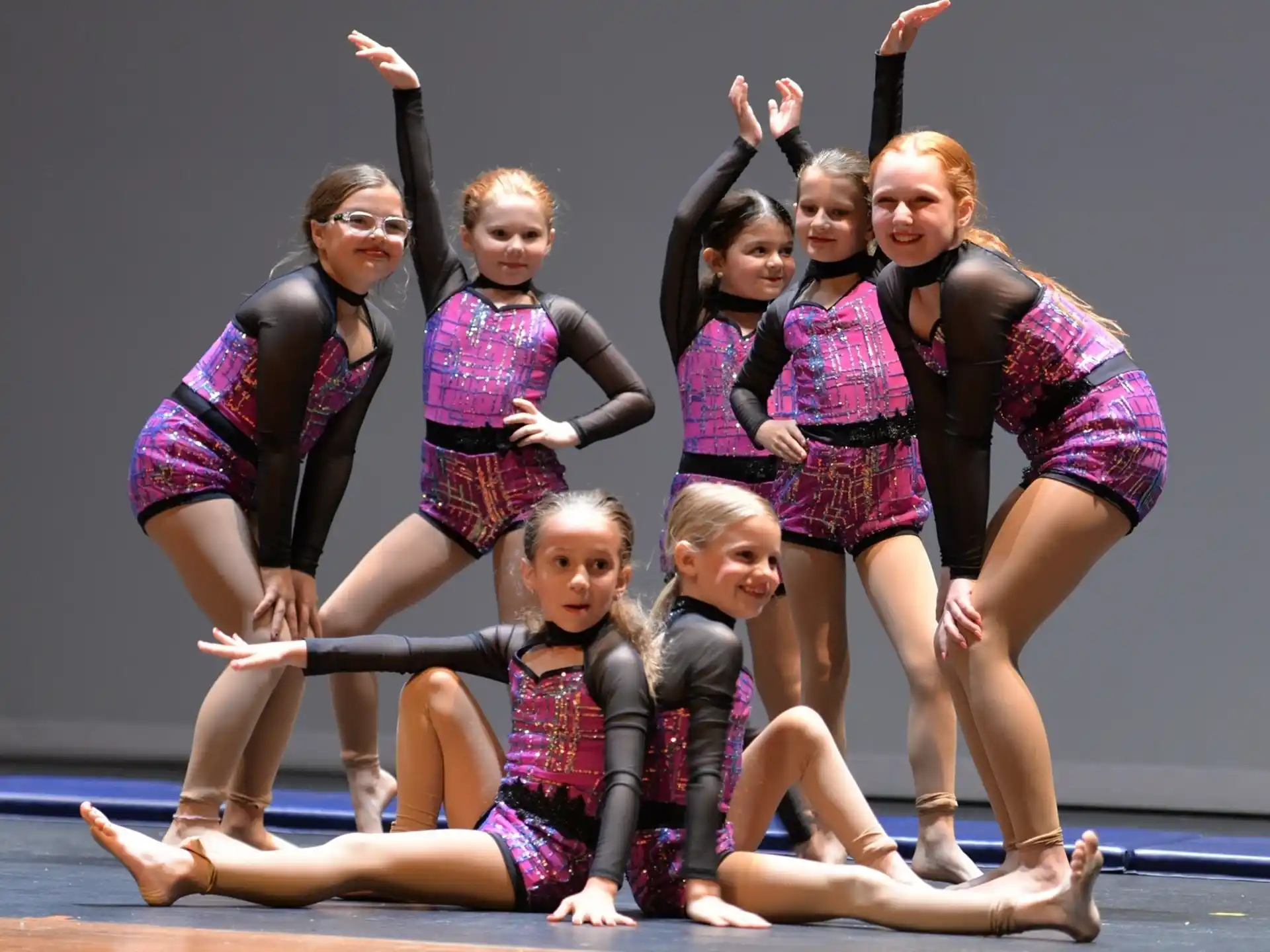 a group of girls posing for a photo