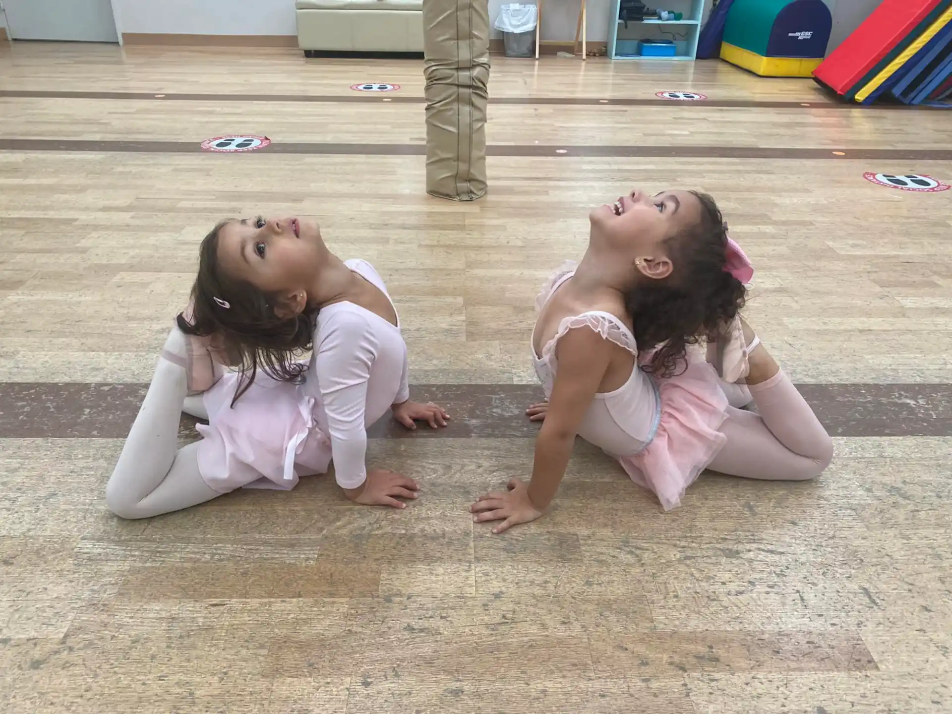 two women lying on the ground