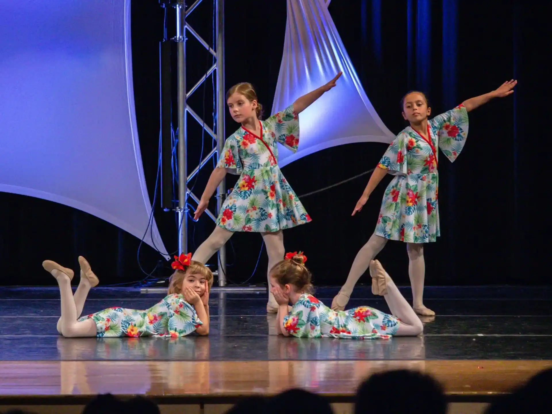 a group of girls performing on a stage